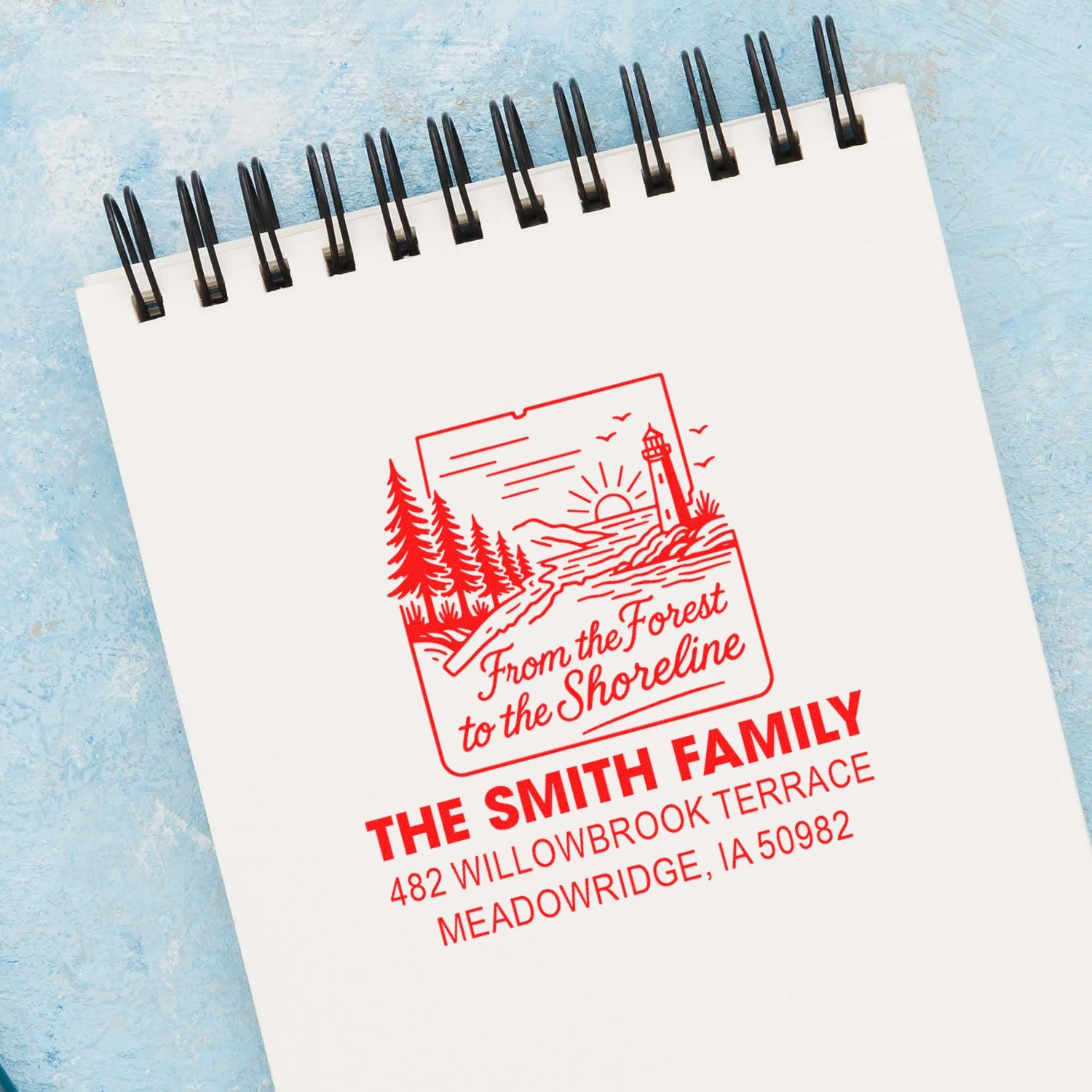 Custom rubber address stamp imprint with forest-to-shoreline design for The Smith Family, Meadowridge, IA.