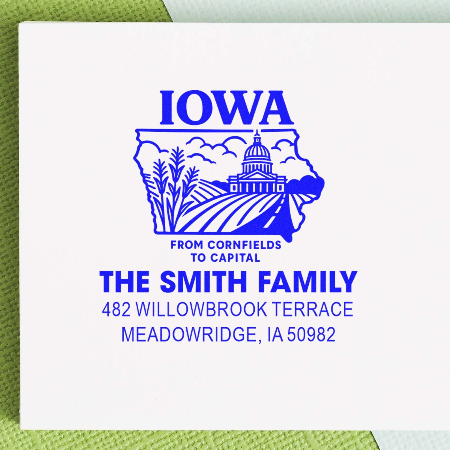 Custom Iowa return address rubber stamp for The Smith Family, featuring state graphic and Meadowridge, IA address.