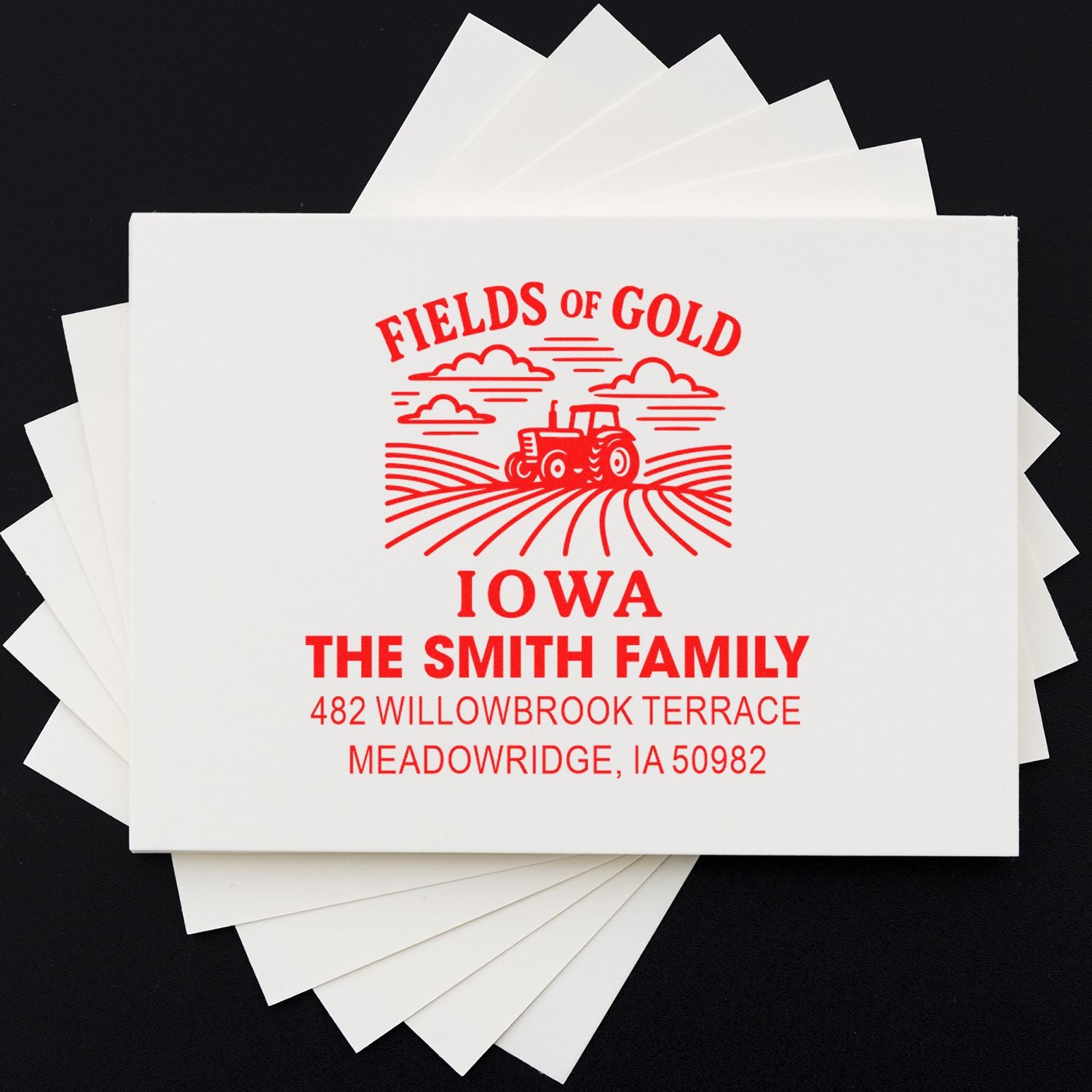 Custom rubber address stamp with farm tractor logo and personalized Smith Family return address for Meadowsridge, Iowa.