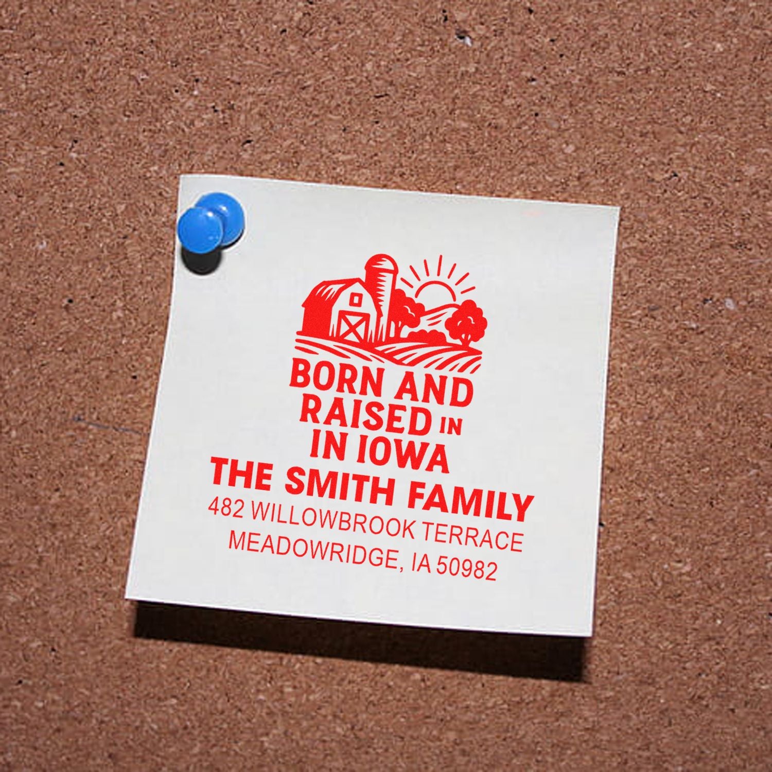 Personalized rubber stamp design reading Born and Raised in Iowa for The Smith Family address, shown on a pinned note.