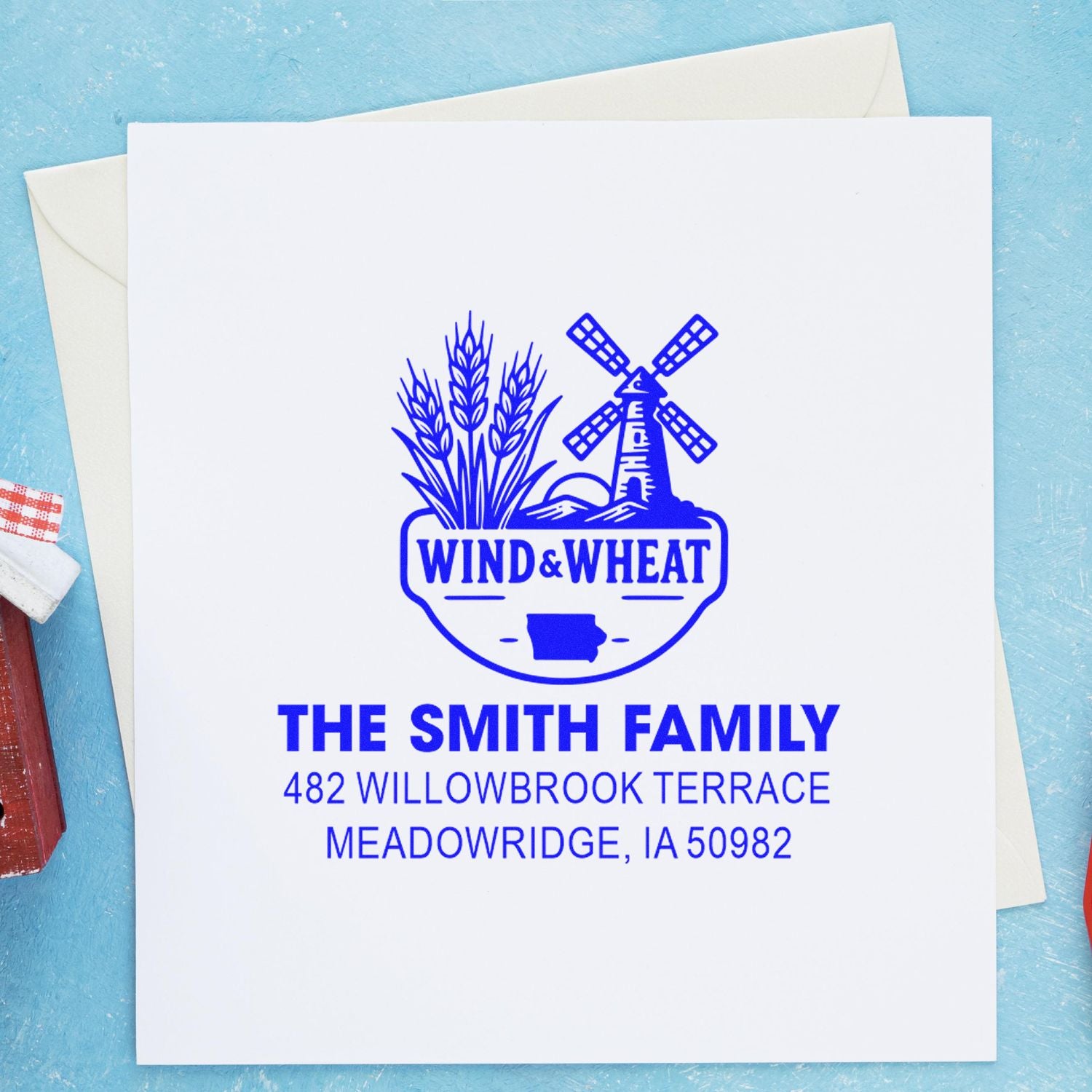 Custom rubber address stamp with windmill and wheat design, personalized return address for The Smith Family envelopes.