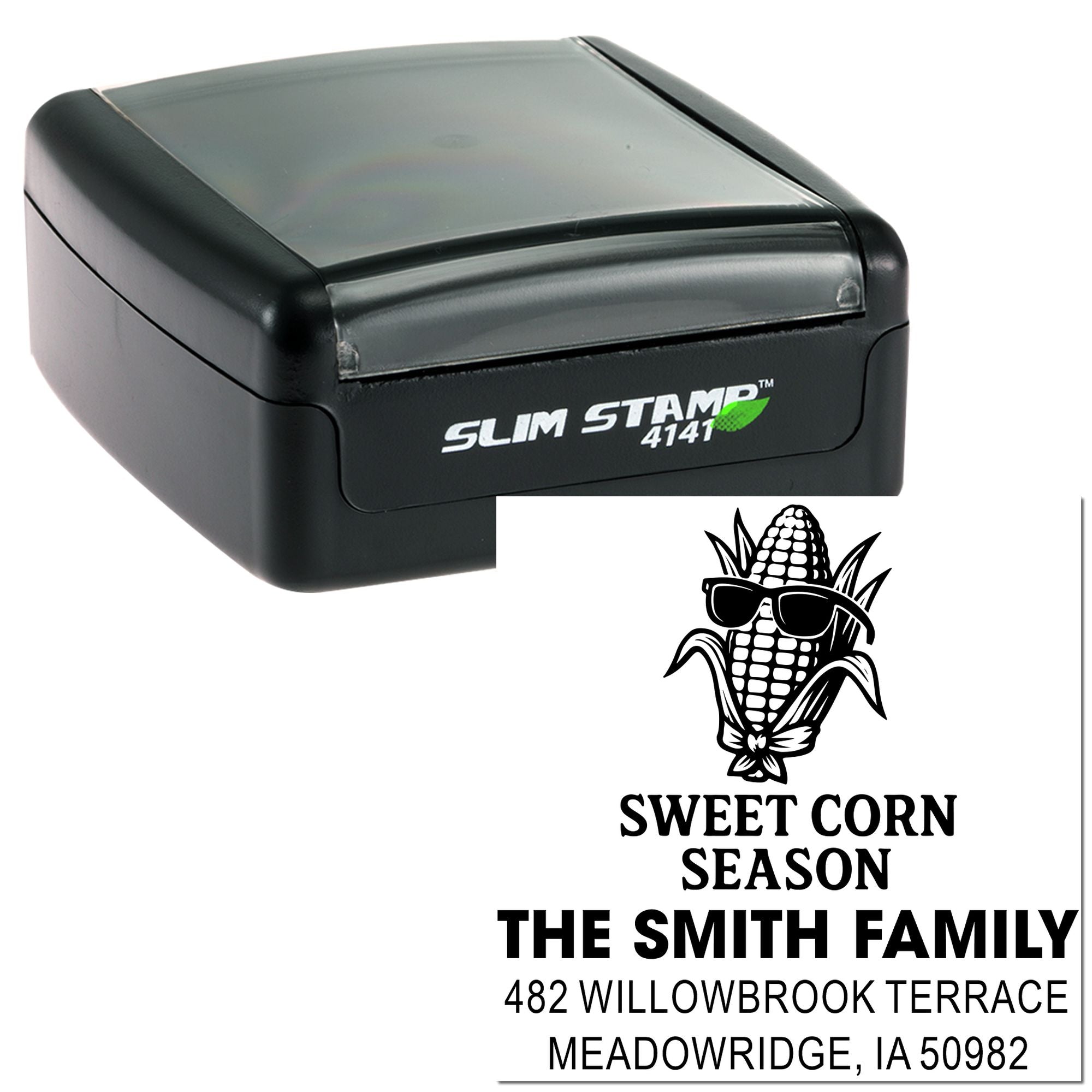 Custom self-inking address rubber stamp with corn graphic, family name, and full mailing address.