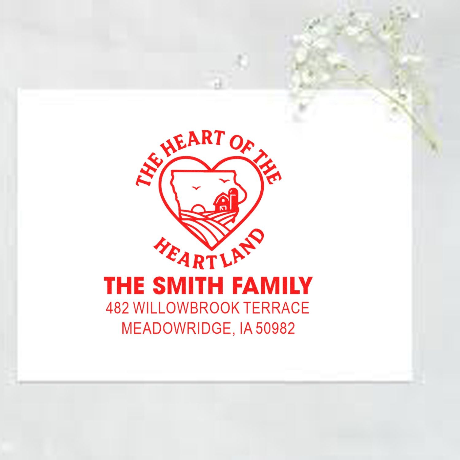 Custom family address rubber stamp with Heart of the Heartland design for The Smith Family, Meadowridge, IA 50982.