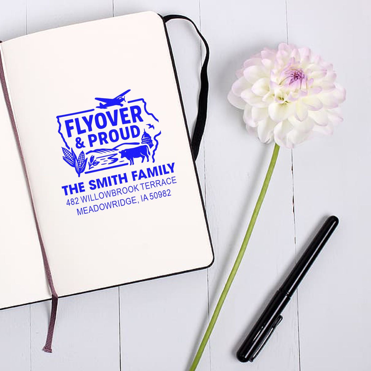 Custom rubber stamp impression for The Smith Family return address with Flyover & Proud Iowa design.