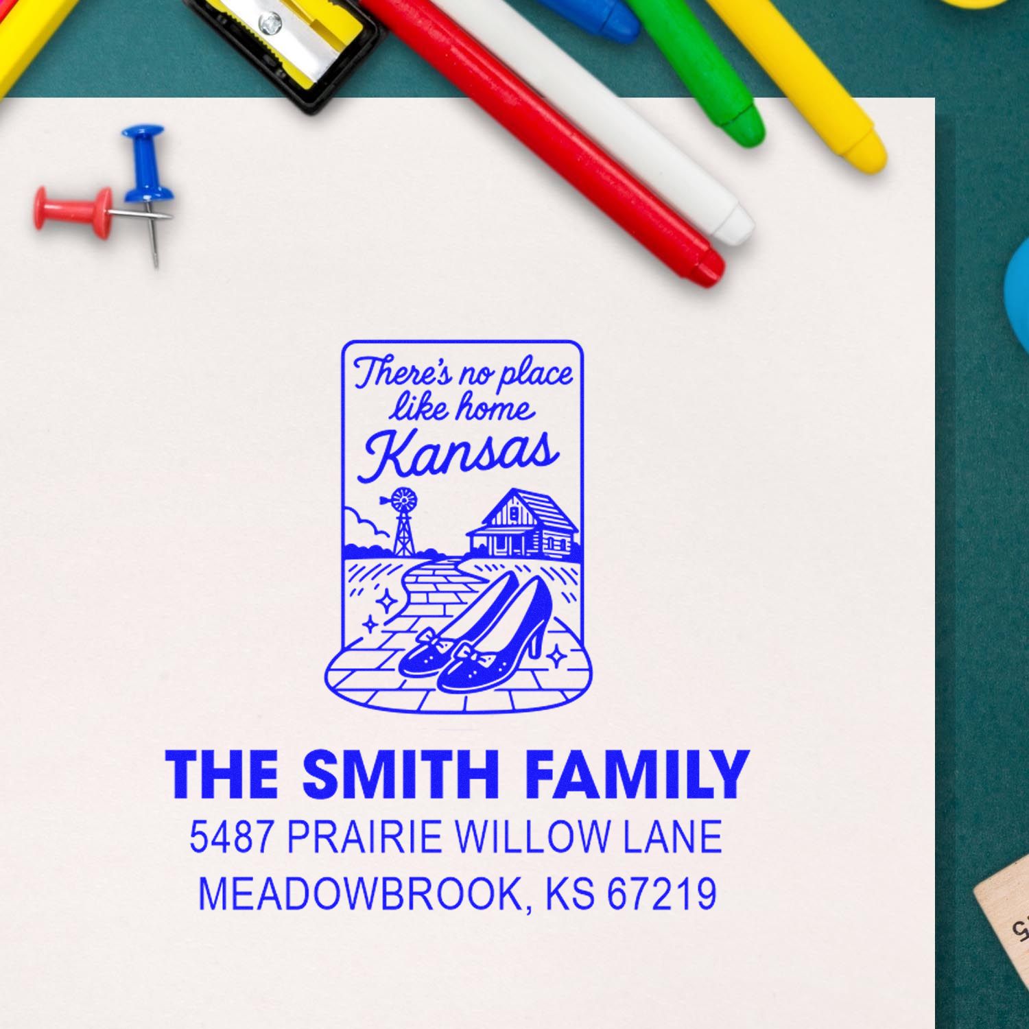 Personalized Kansas address rubber stamp with family name and Theres no place like home design for return mail.