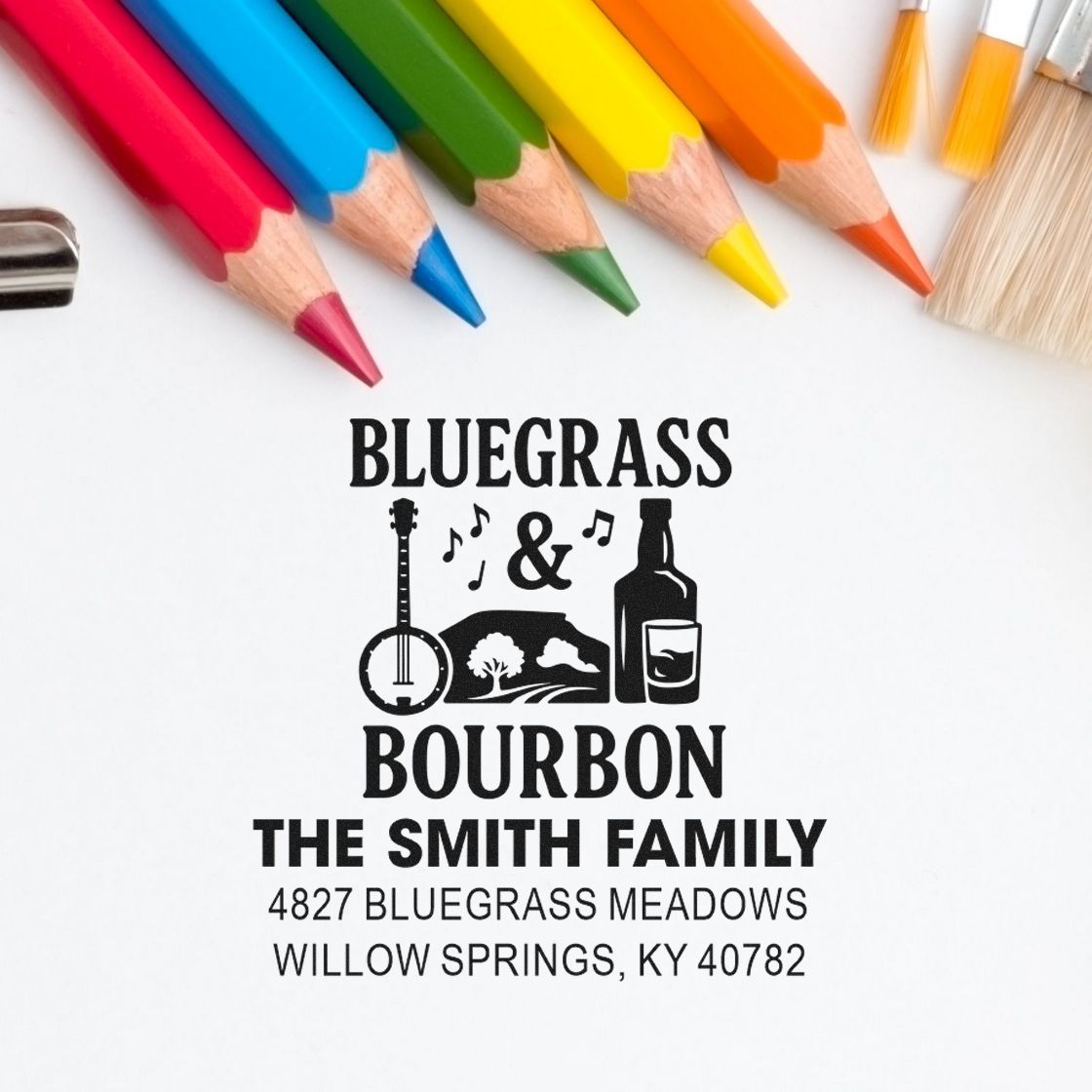 Personalized bluegrass bourbon address rubber stamp with family name and Kentucky address, shown with colorful pencils.