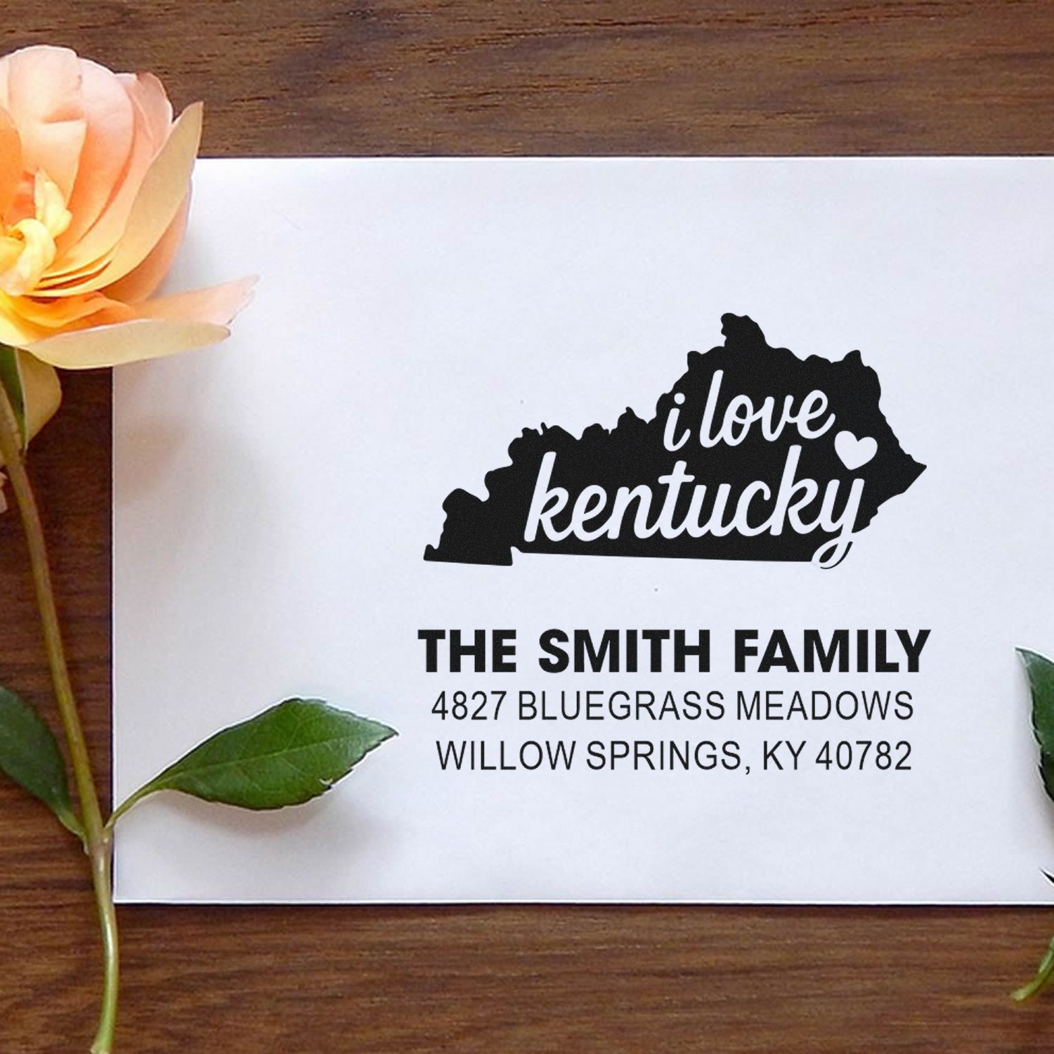 Custom Kentucky address rubber stamp with I love Kentucky state silhouette and personalized family name and mailing address.