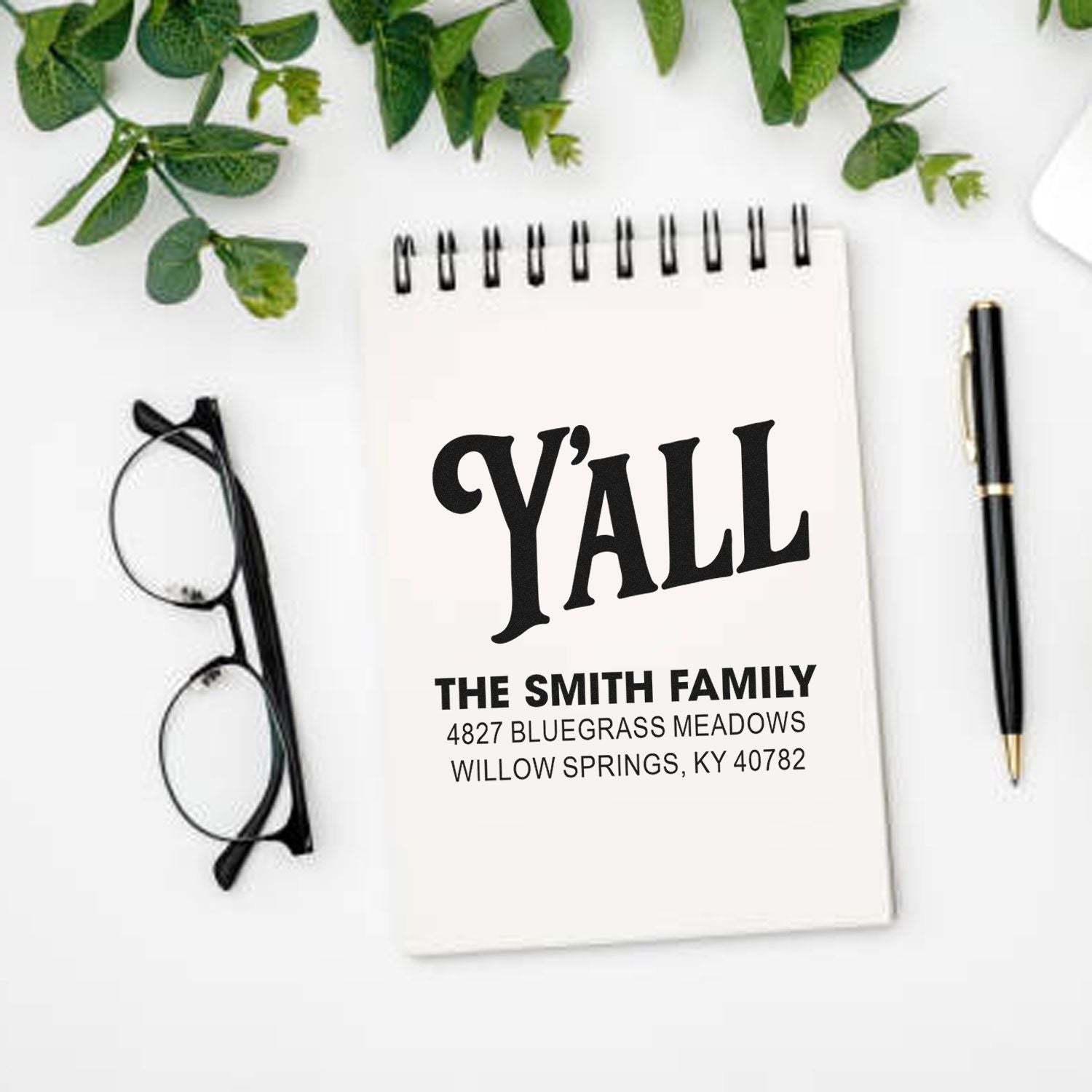 Custom rubber stamp design for personalized stationery, featuring Yall, The Smith Family, and a return address on a notepad.