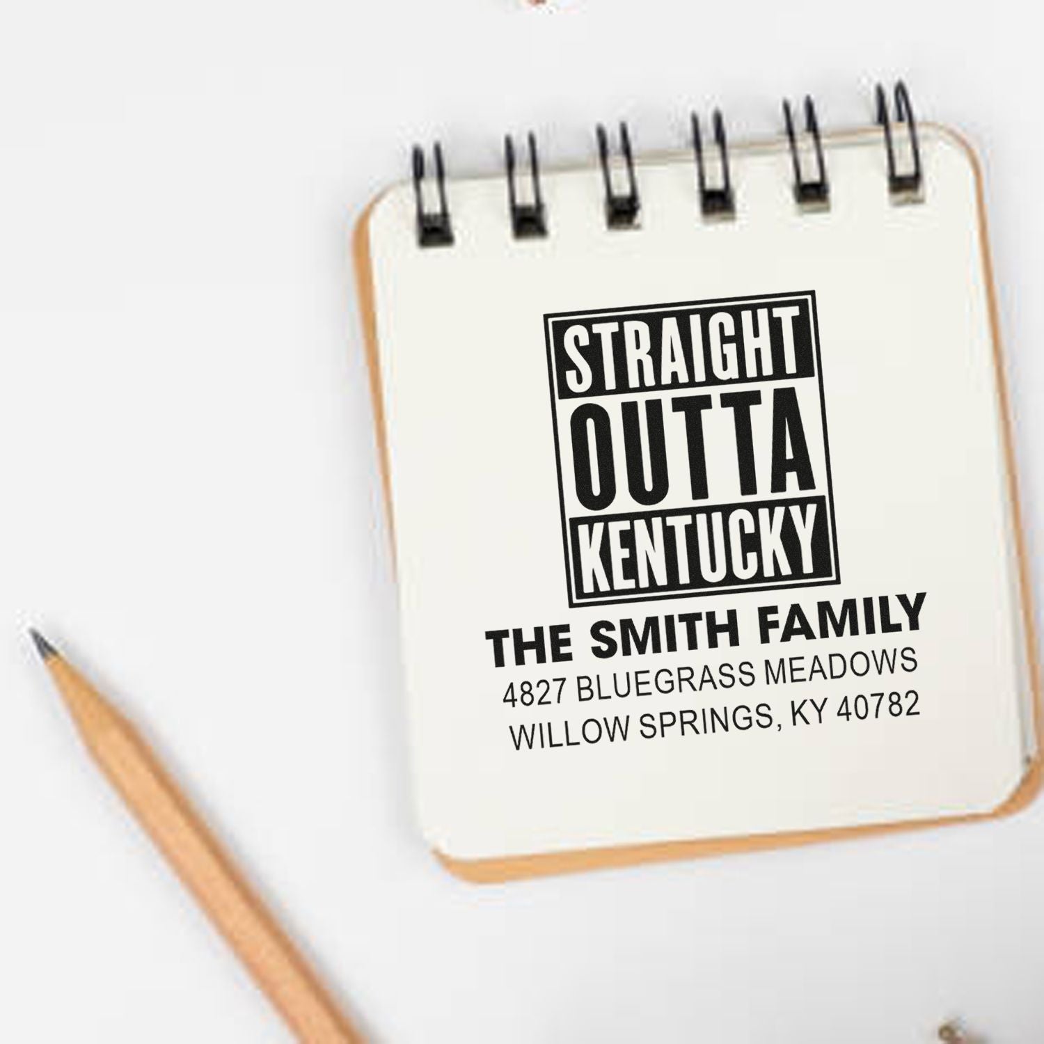 Custom rubber stamp mockup with Straight Outta Kentucky return address design for The Smith Family, Willow Springs, KY.