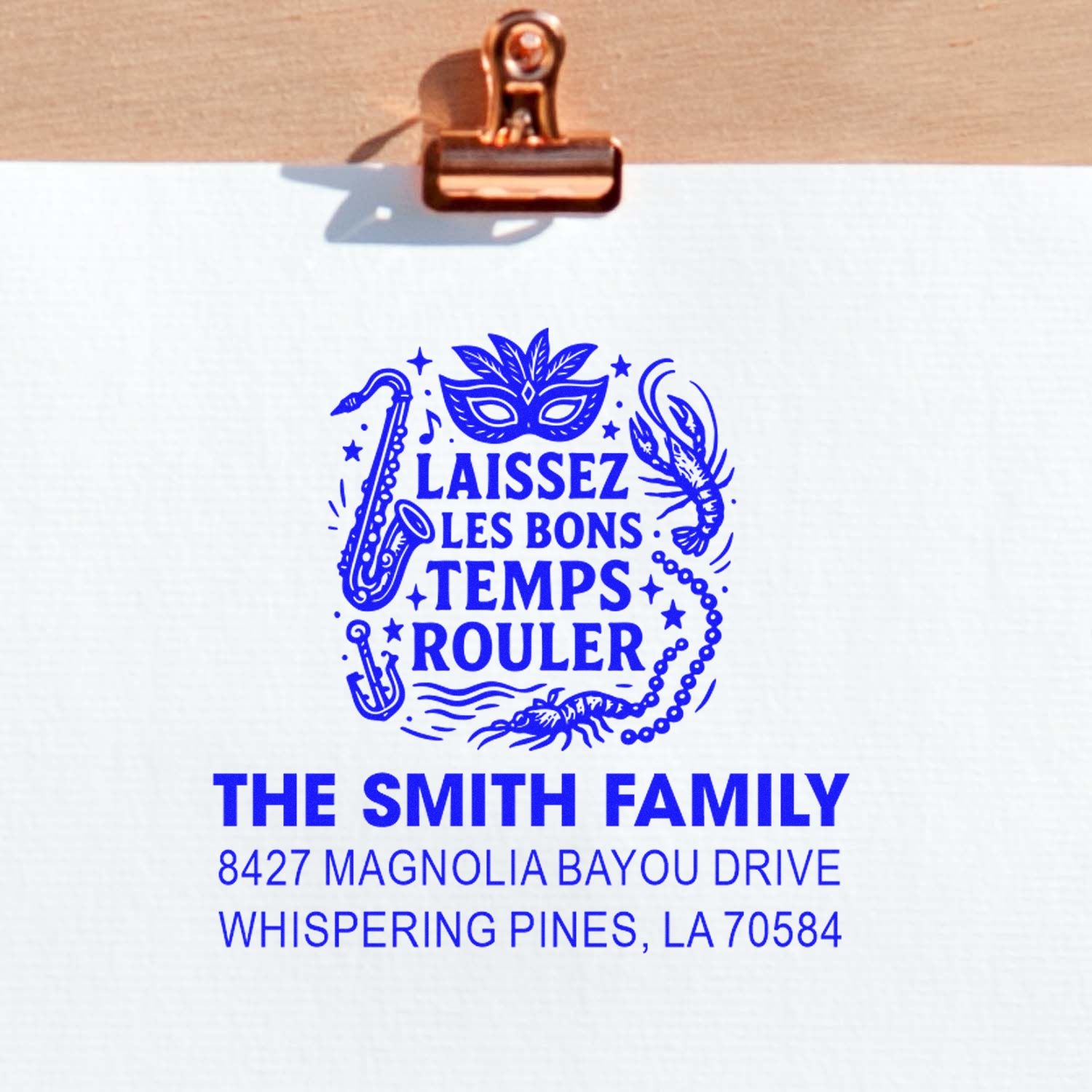 Custom rubber stamp with Mardi Gras Laissez les bons temps rouler design and The Smith Family return address.