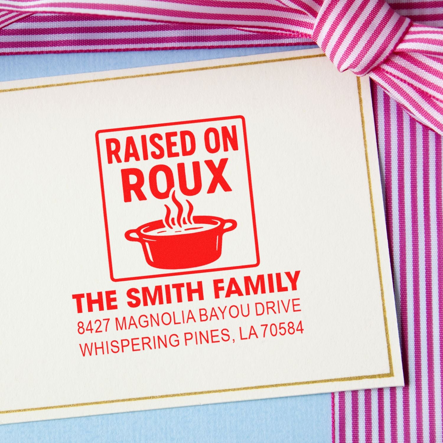 Custom rubber stamp for personalized stationery featuring Raised on Roux and family address with a Cajun cooking theme.