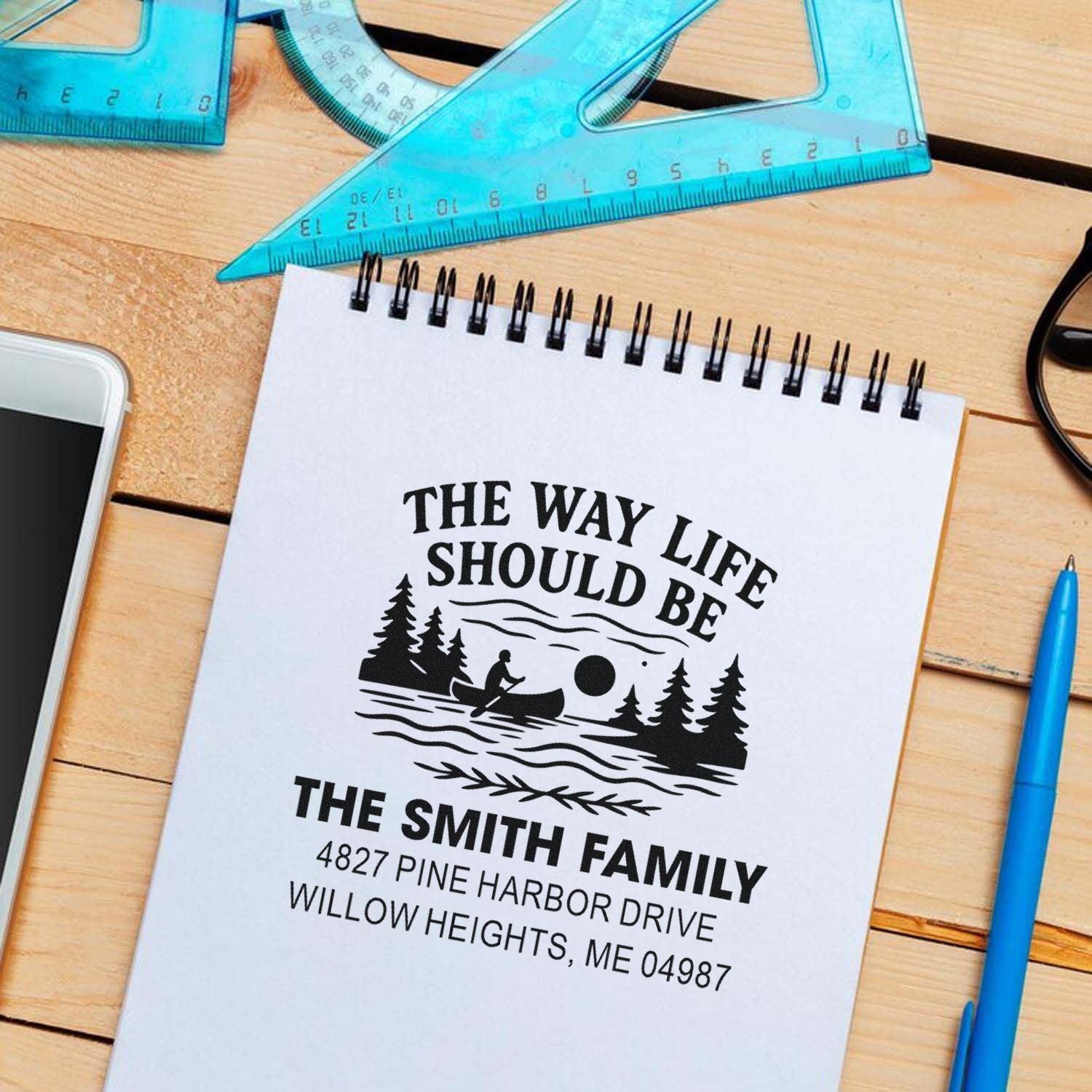 Personalized family return address rubber stamp with canoe design for custom mail, stationery, and address labels.