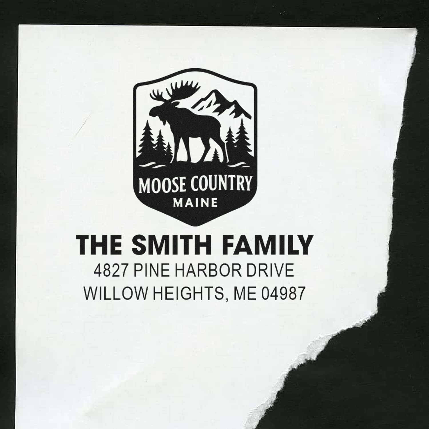 Custom address rubber stamp with Moose Country Maine moose logo and The Smith Family return address.
