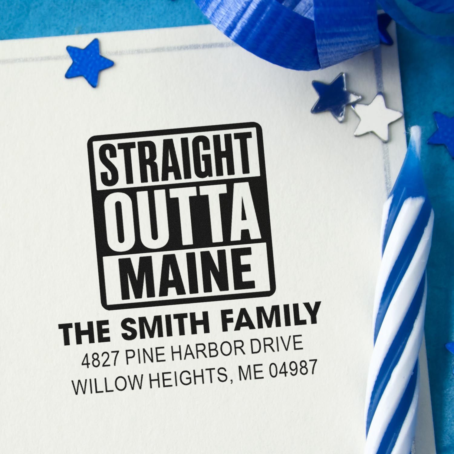 Custom address rubber stamp reading Straight Outta Maine with family name and address on patriotic stationery.