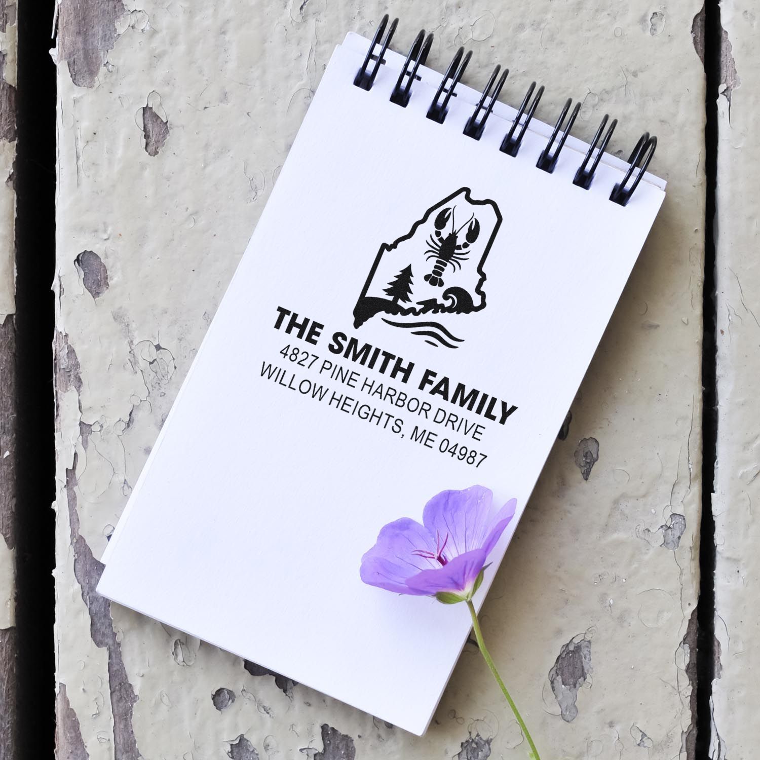 Personalized family return address rubber stamp impression for custom stationery, featuring a Maine-themed logo.