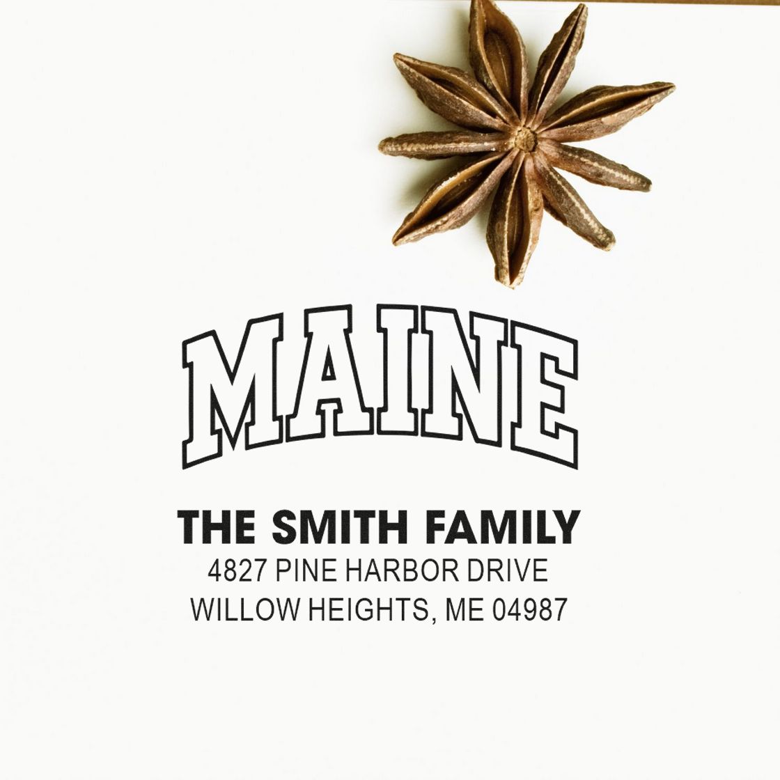 Custom Maine return address rubber stamp for The Smith Family with address and decorative star anise.