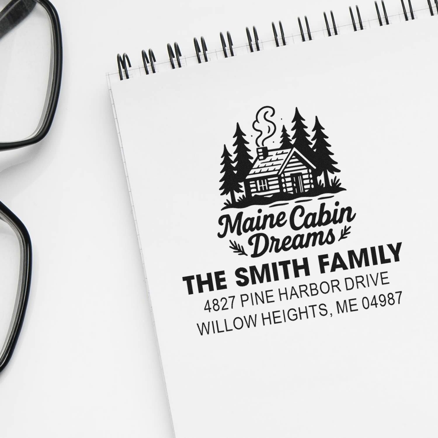 Custom address rubber stamp with Maine cabin logo, The Smith Family name, and return address for personalized mailing.