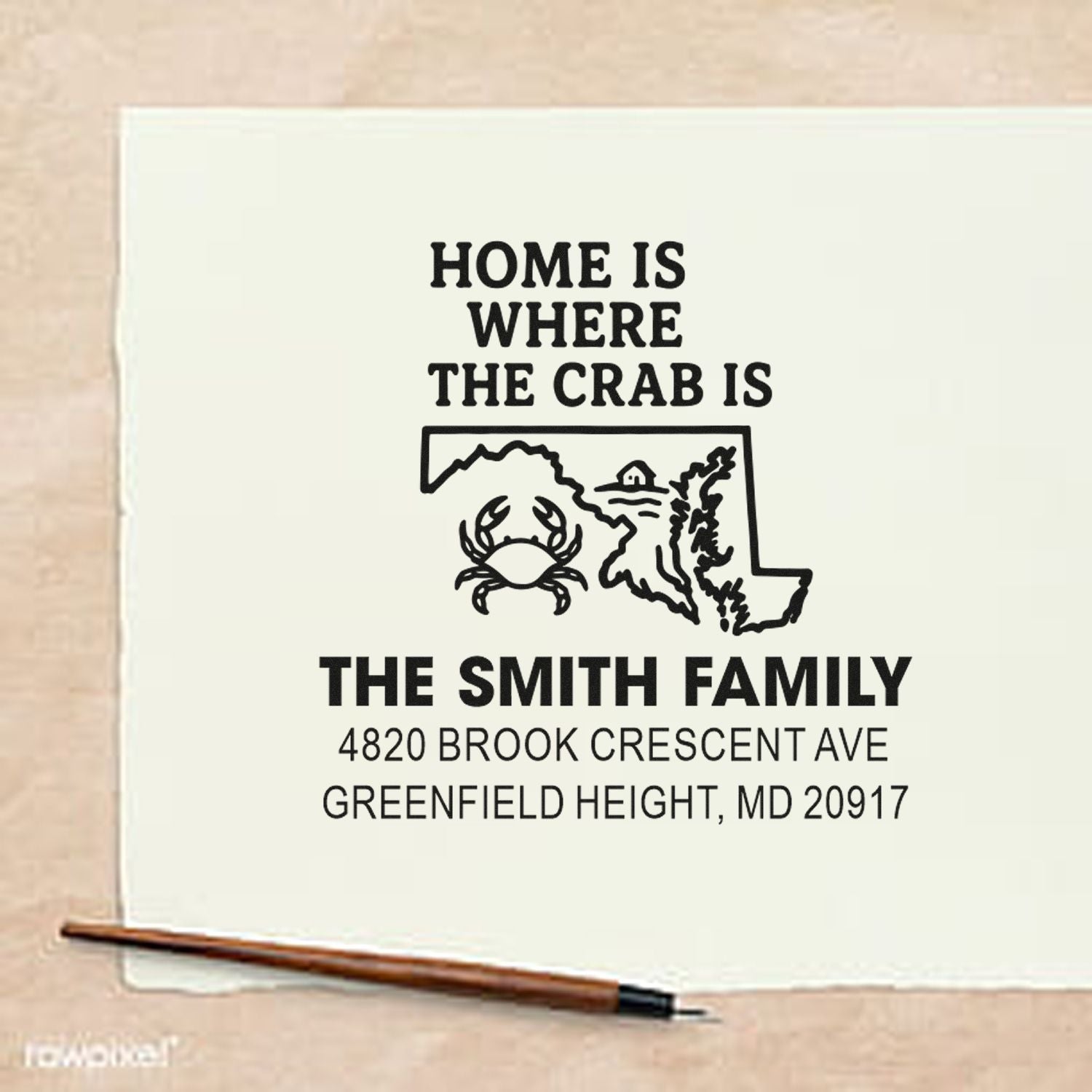 Custom rubber stamp with Maryland crab design and family address, reading Home is where the crab is.