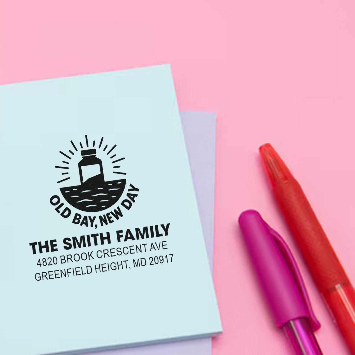 Custom family return address rubber stamp with lighthouse logo and Greenfield Heights, MD address.