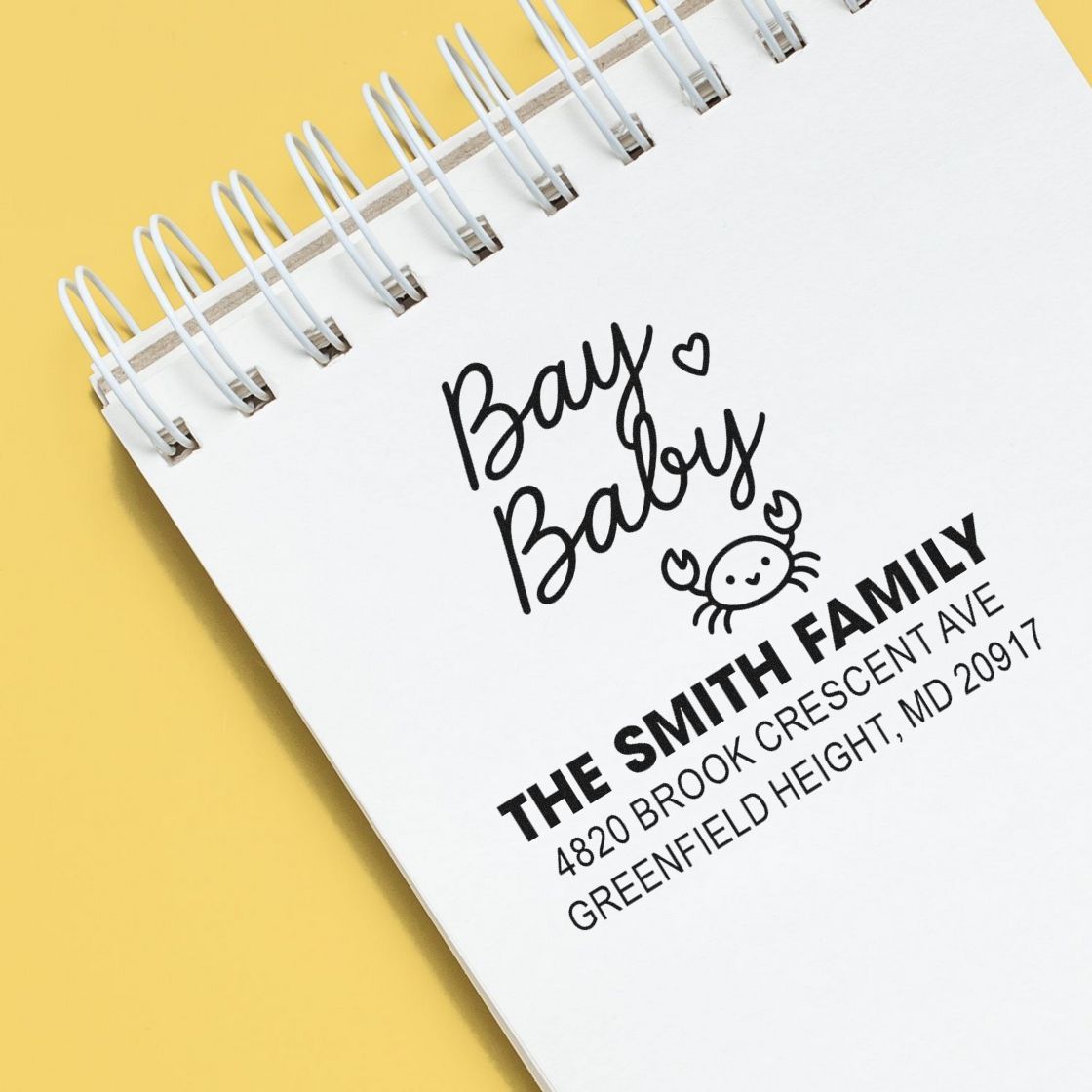 Custom baby-themed rubber stamp with family name and return address for envelopes.