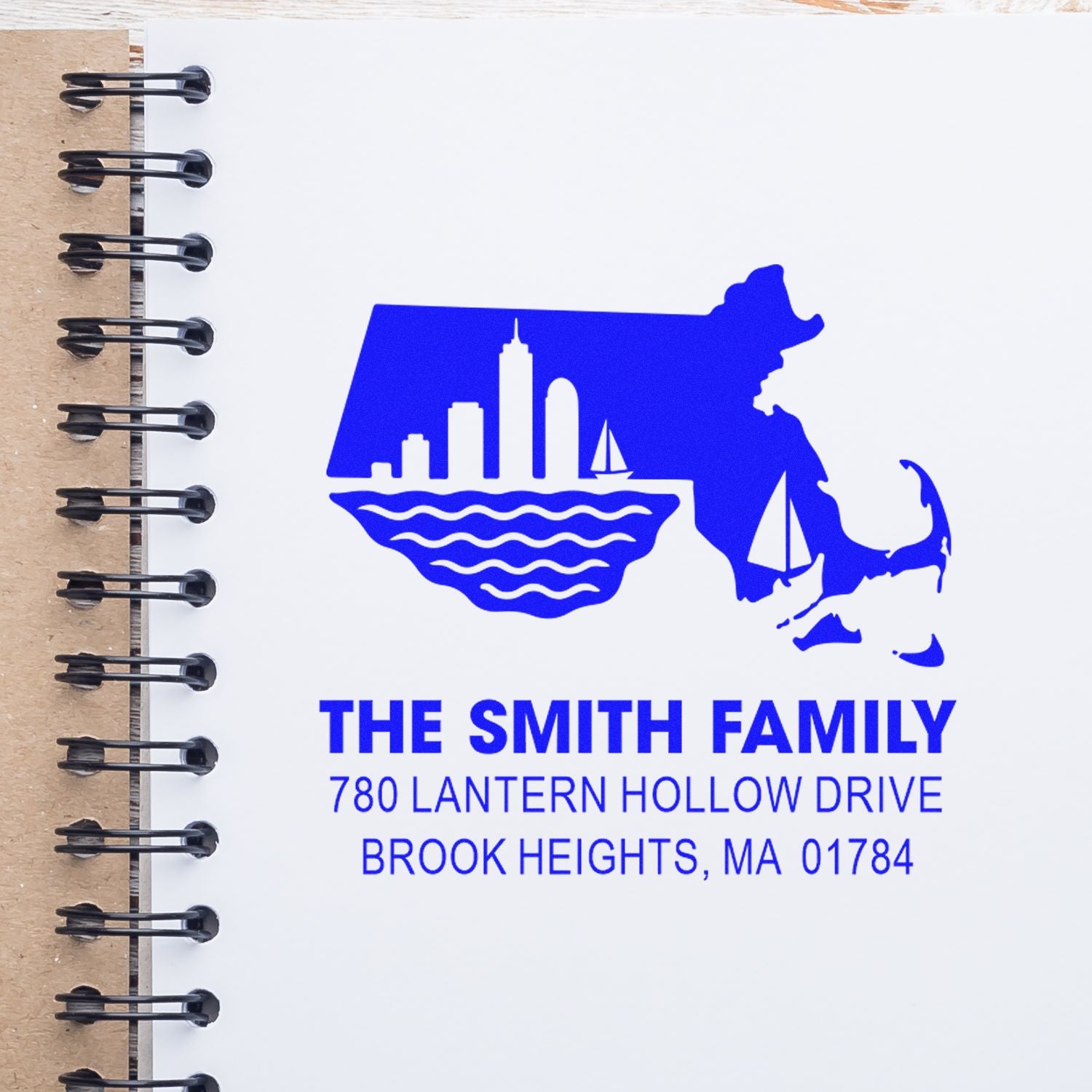Custom return address rubber stamp for The Smith Family with Massachusetts skyline, sailboats, and Brook Heights, MA address.