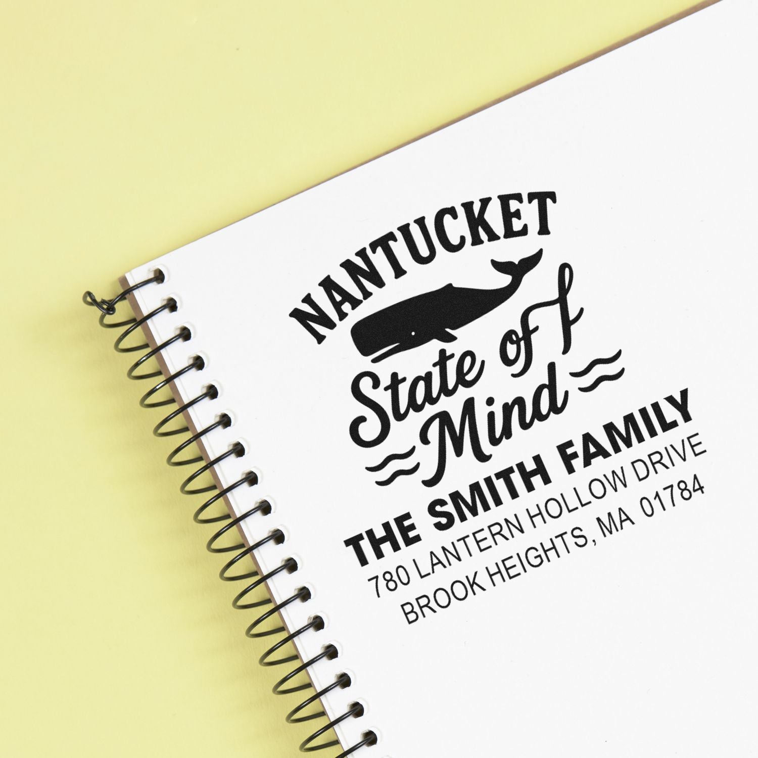 Custom Nantucket whale return address rubber stamp on notebook, featuring State of Mind design for family mailings.