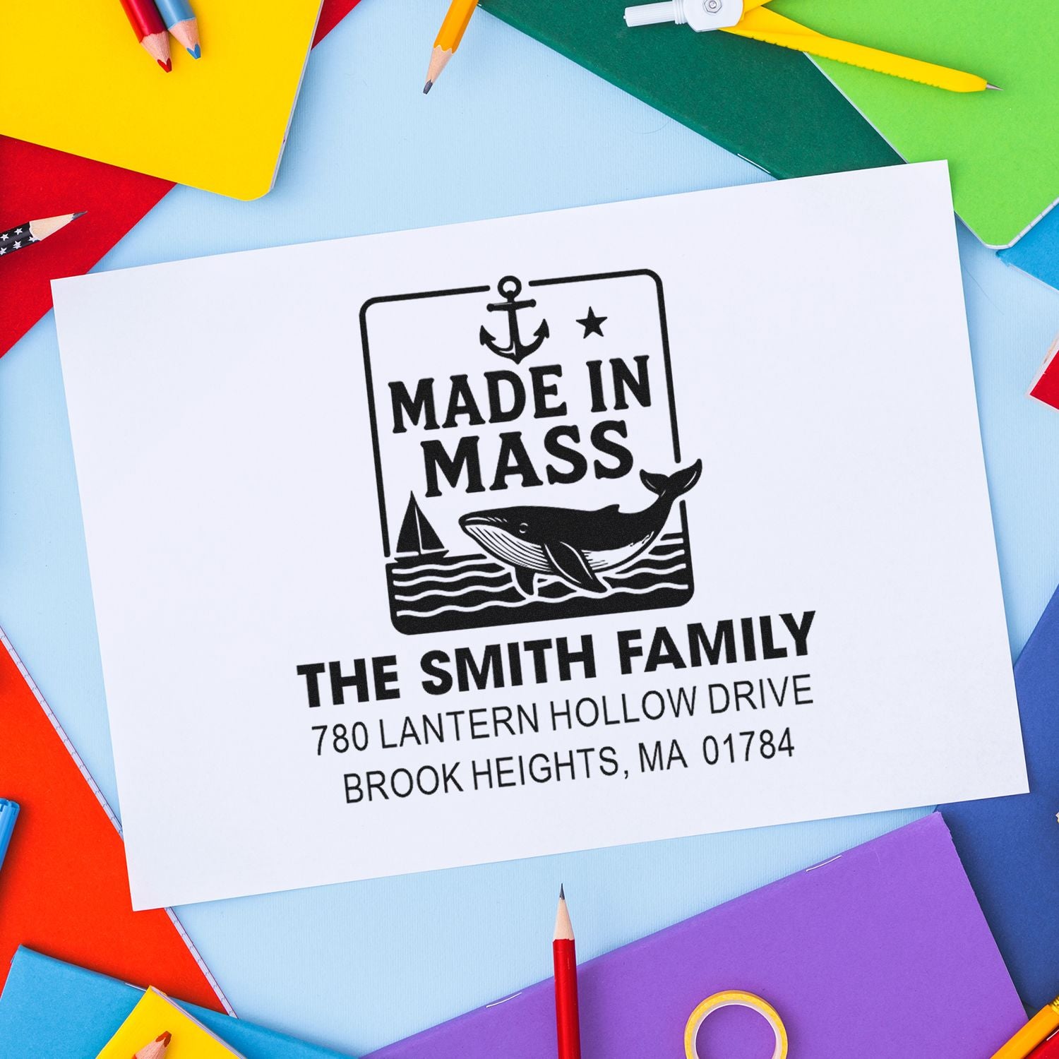 Custom rubber stamp with Made in Mass whale design and Smith family return address for stationery.