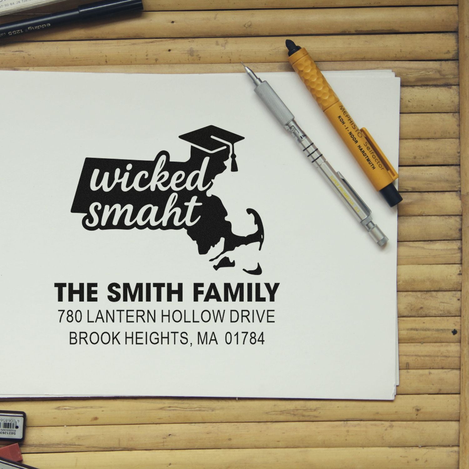 Personalized rubber stamp proof with wicked smaht graduate design and The Smith Family return address.