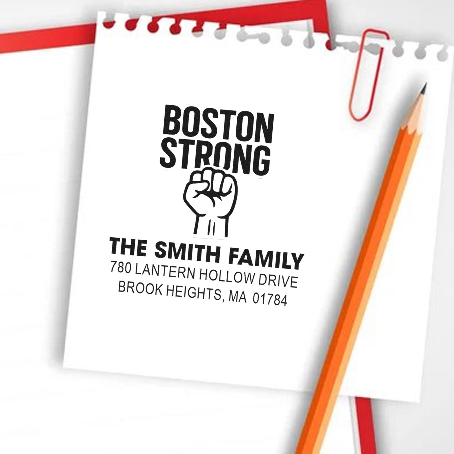 Custom Boston Strong rubber stamp with family name and address for personalized mail and stationery.