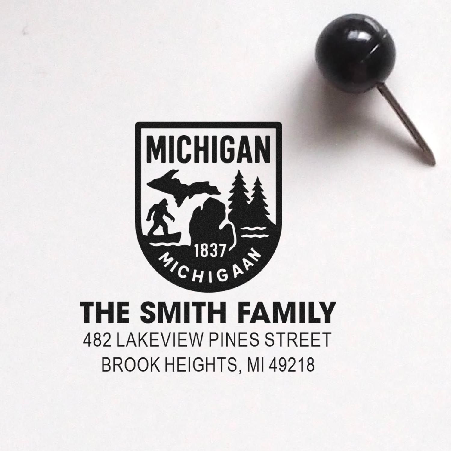 Custom Michigan return address rubber stamp for The Smith Family, with state emblem and Brook Heights, MI 49218.