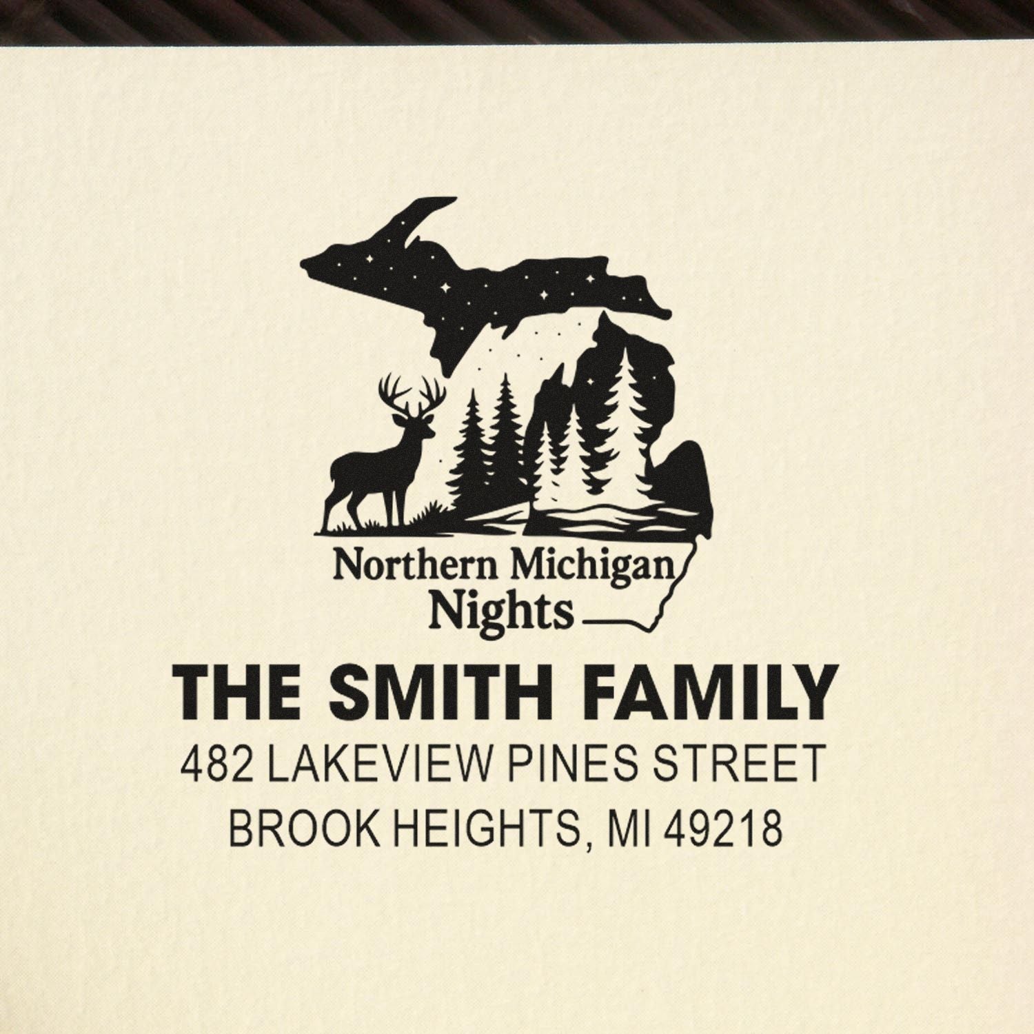 Custom return address rubber stamp with Northern Michigan Nights design, deer and trees, for The Smith Family in Brook Heights, MI 49218