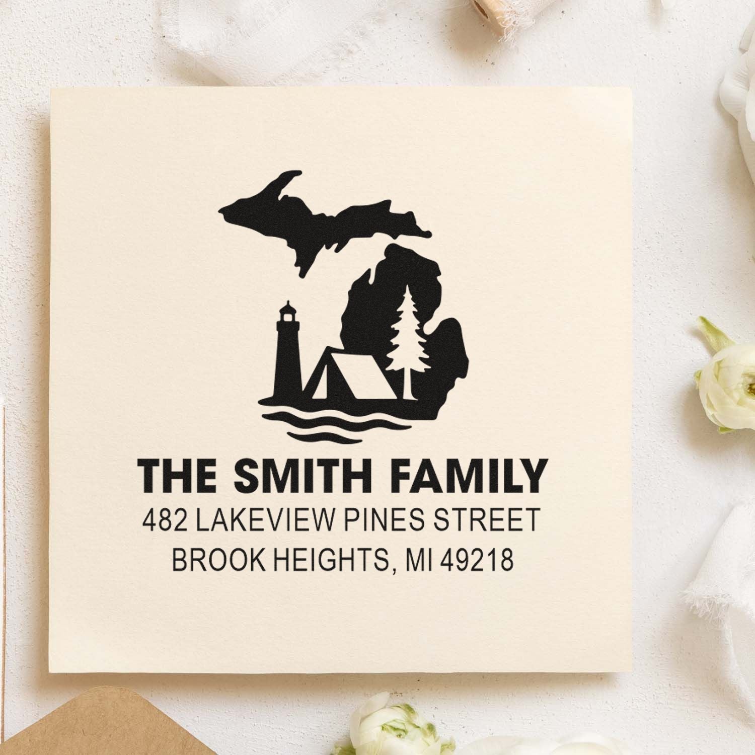 Personalized family address rubber stamp with Michigan lake, lighthouse, tent and pine design for custom mailings.