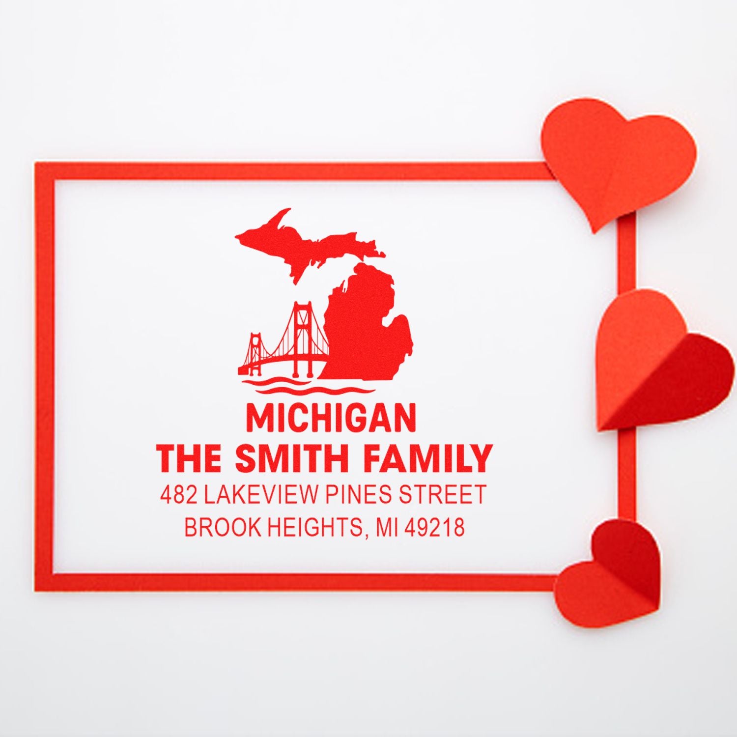 Custom Michigan return address rubber stamp for The Smith Family with home address and heart design.