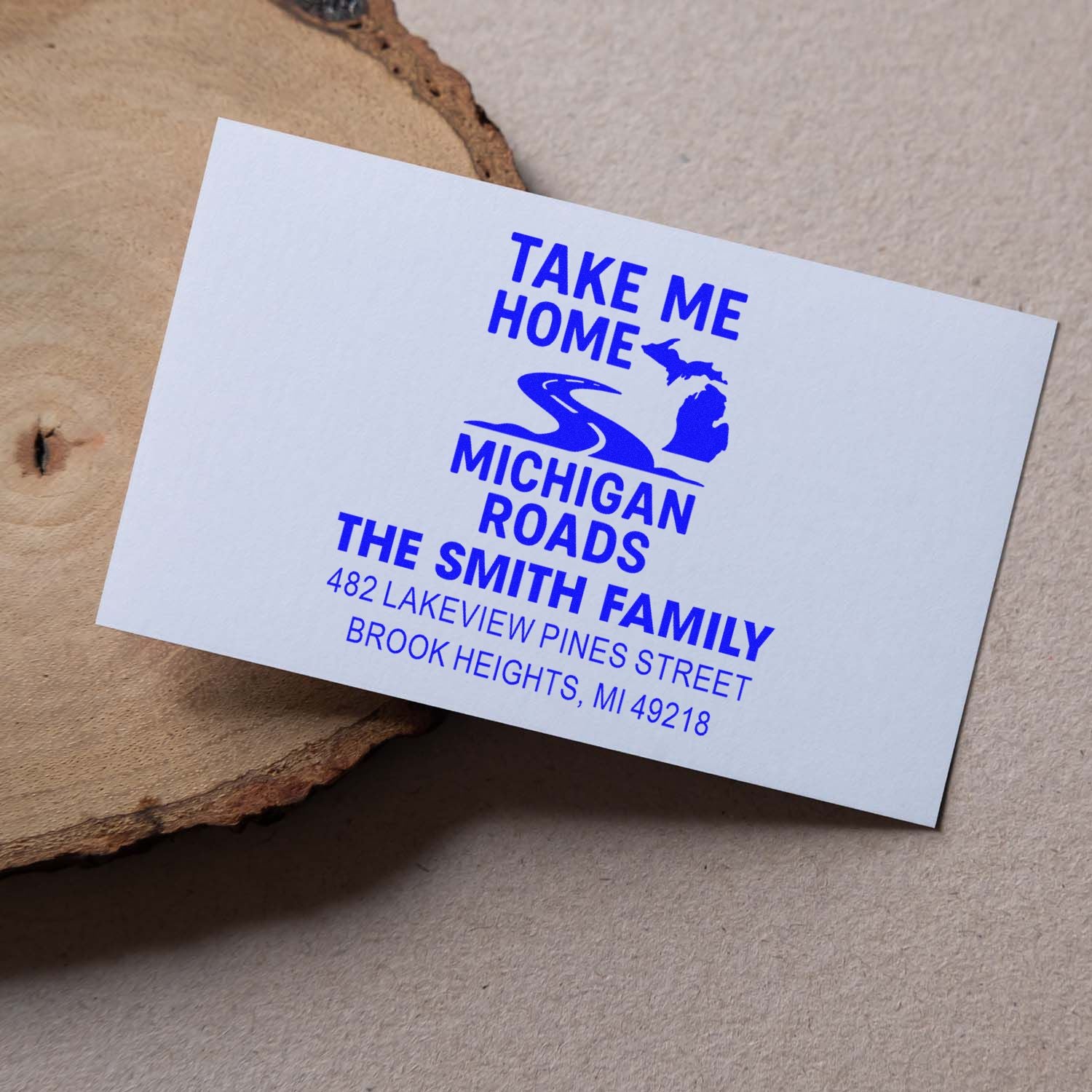 Personalized Michigan return address stamp for The Smith Family with blue Take Me Home road design.