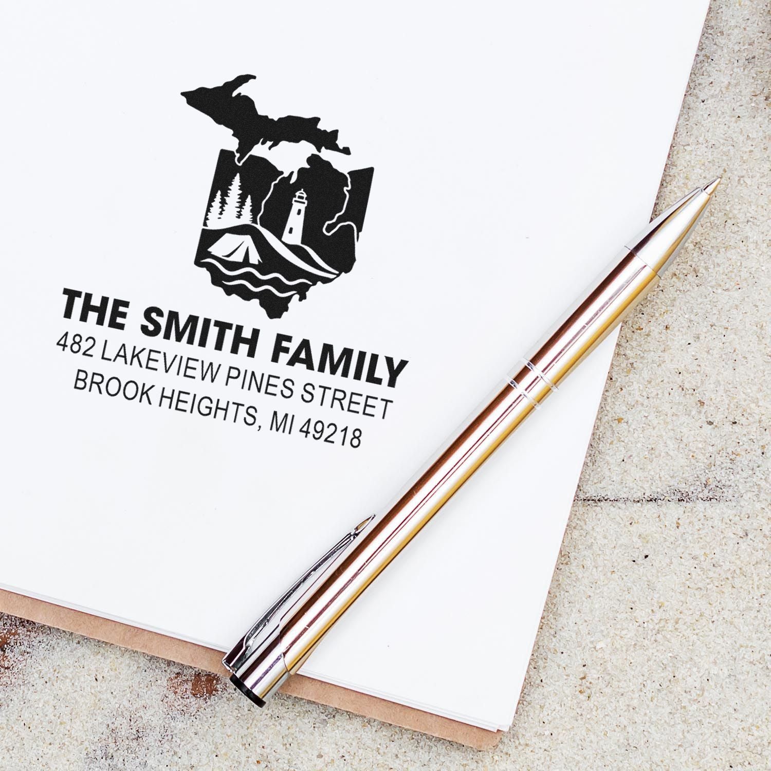 Custom personalized return address rubber stamp with family name, Michigan map and lighthouse design.