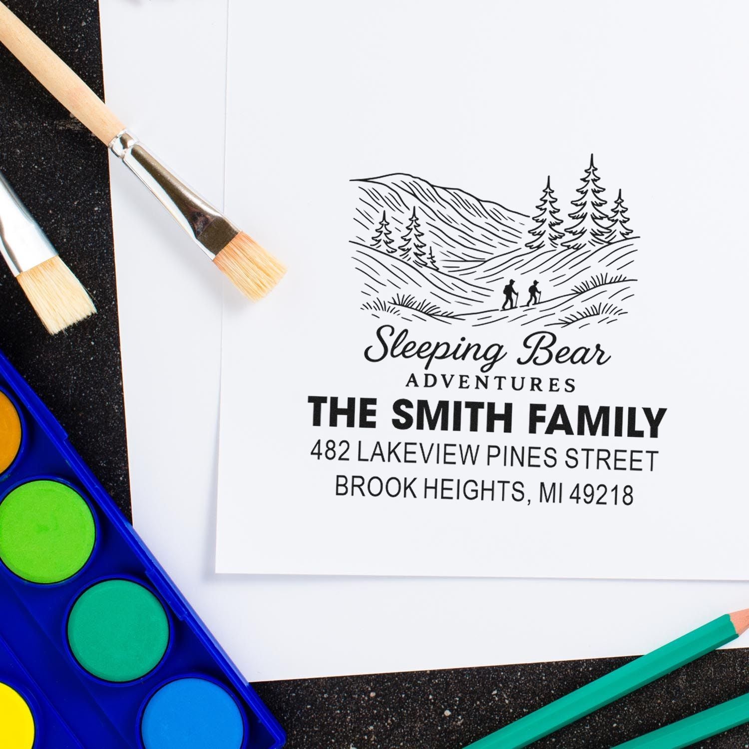 Personalized family address rubber stamp with Sleeping Bear Adventures mountain logo for The Smith Family, Brook Heights, MI.