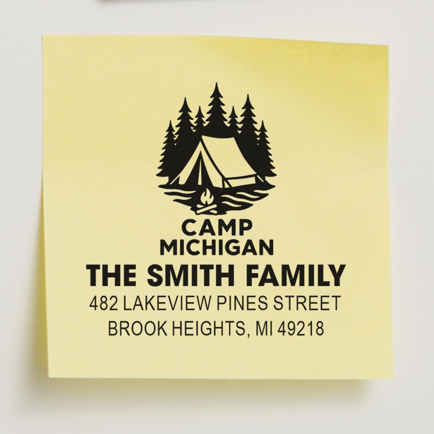 Custom address rubber stamp sample with campsite logo, family name, and Michigan address for personalized return addressing.