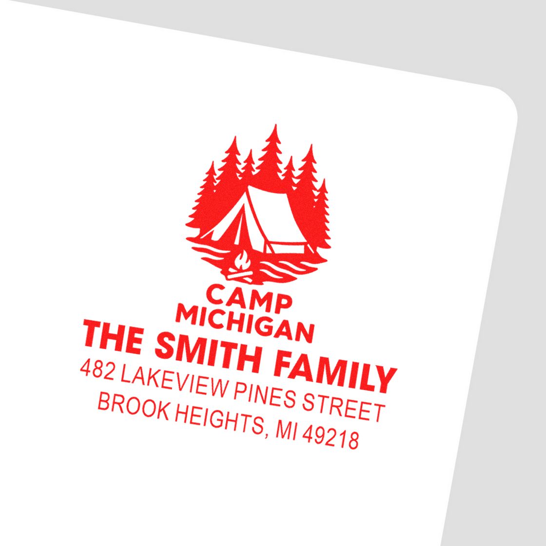 Custom red camping-themed return address rubber stamp for The Smith Family in Brook Heights, MI with tent and pine trees.