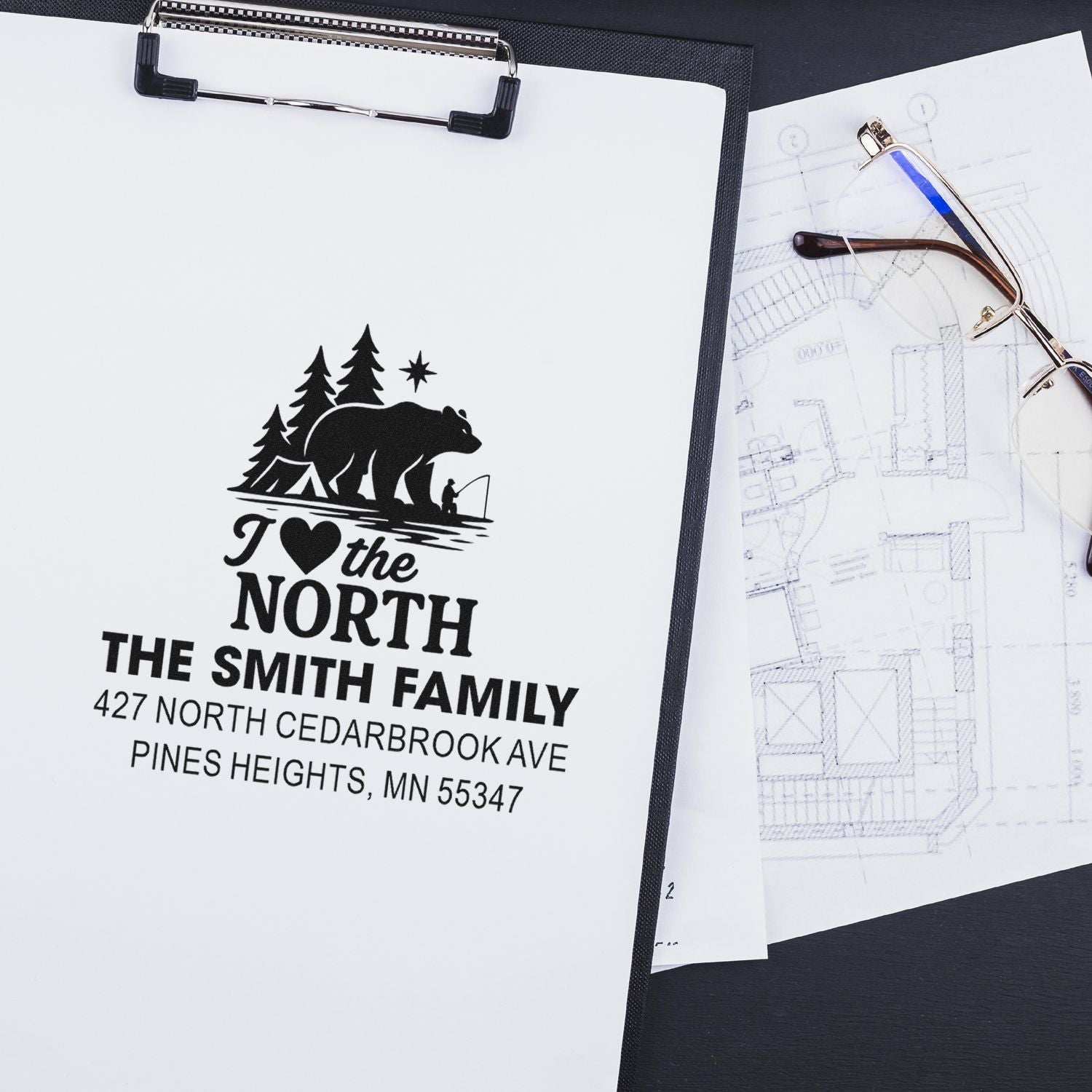 Custom return address rubber stamp proof for The Smith Family with bear and forest logo on a clipboard.