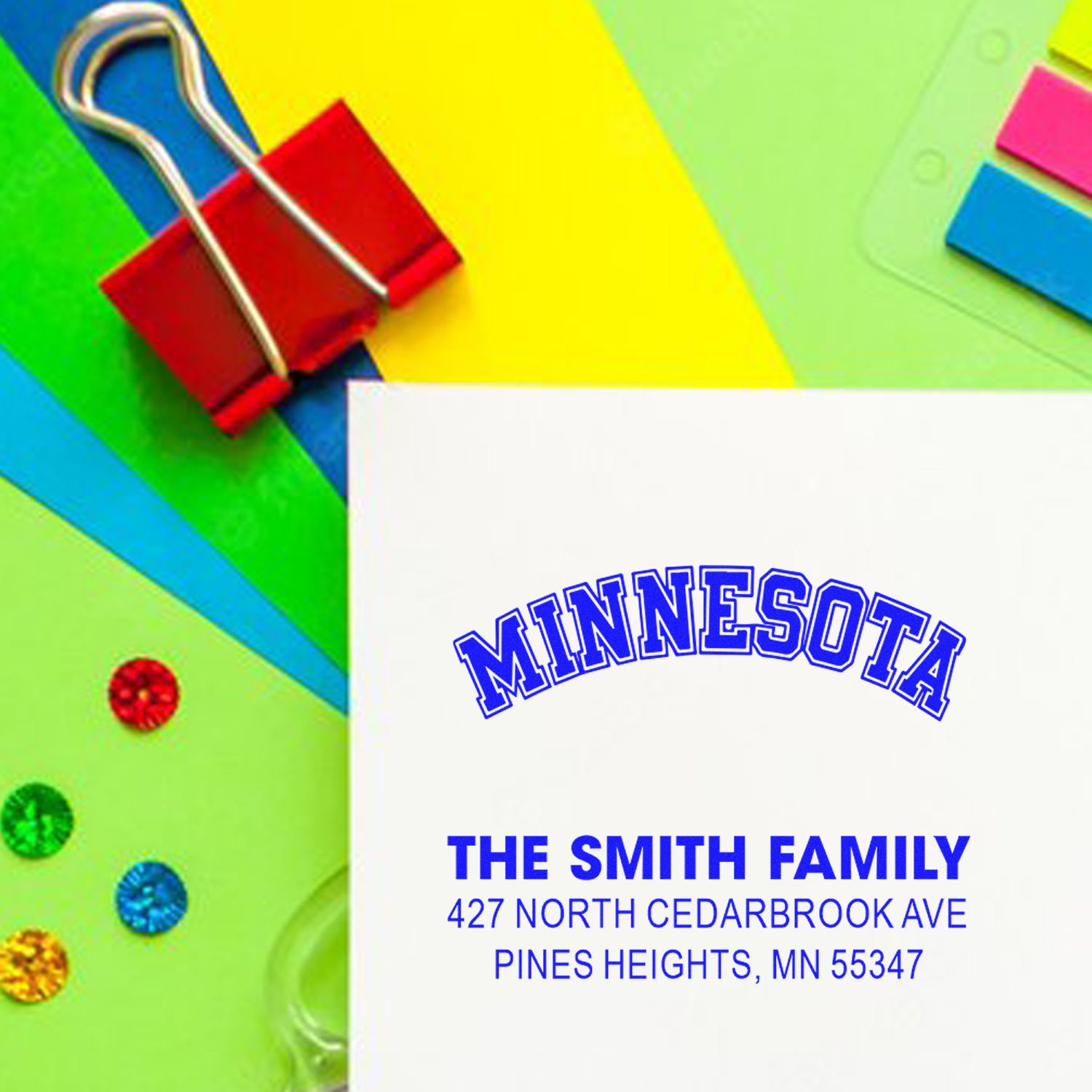 Custom family return address rubber stamp for The Smith Family, Minnesota, on colorful stationery.