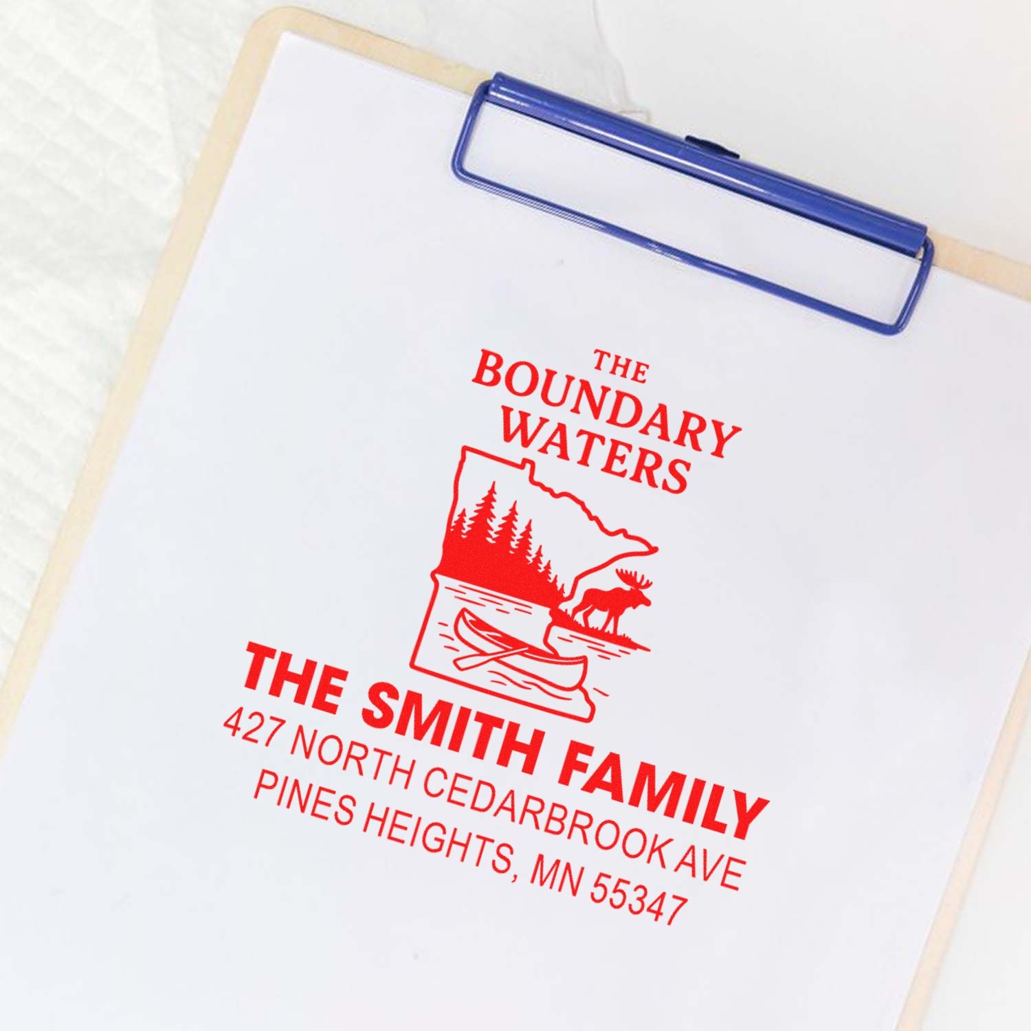 Custom rubber address stamp for The Smith Family, featuring Boundary Waters logo and return address.