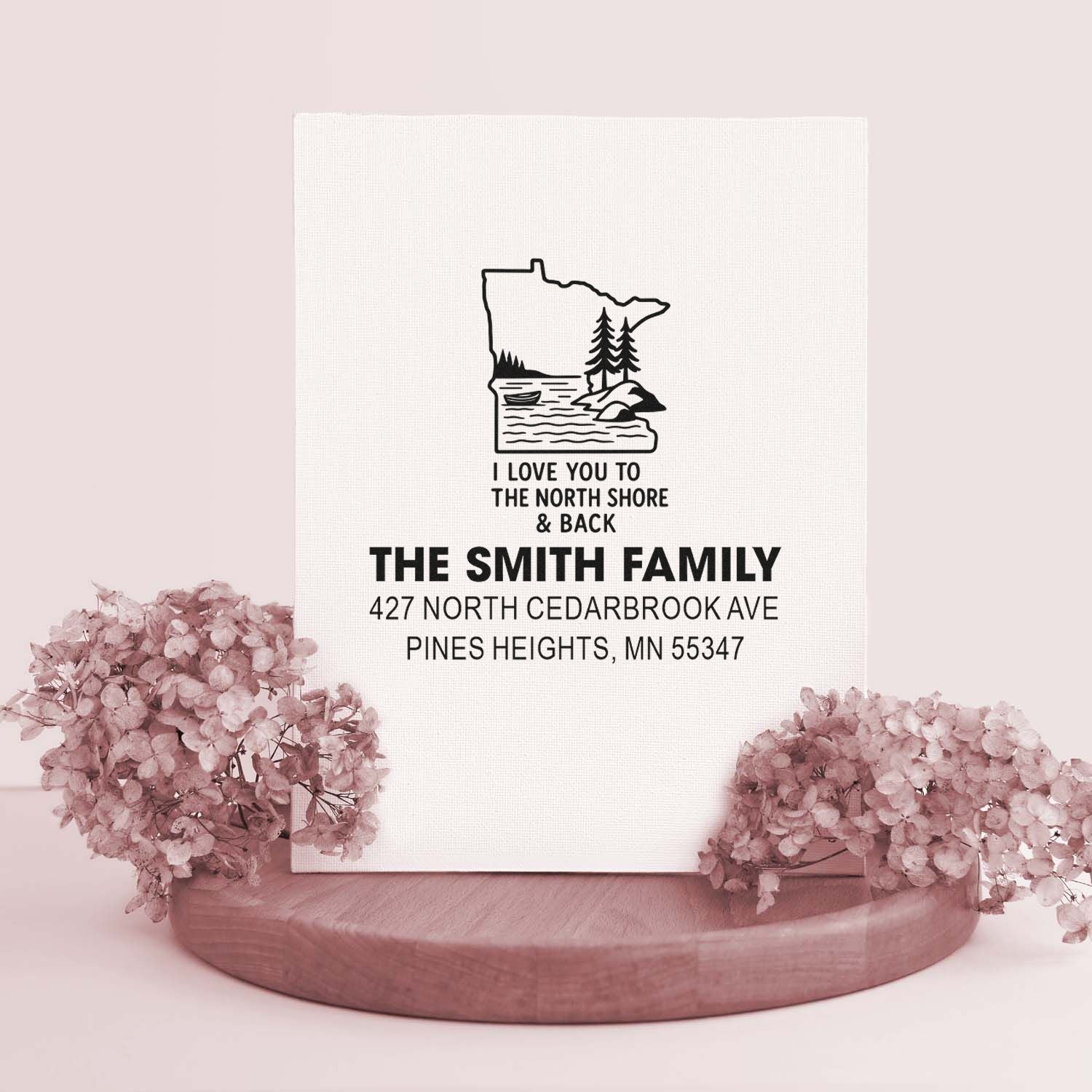 Custom rubber stamp with Minnesota North Shore design, personalized family name, and return address for stationery and gifts.