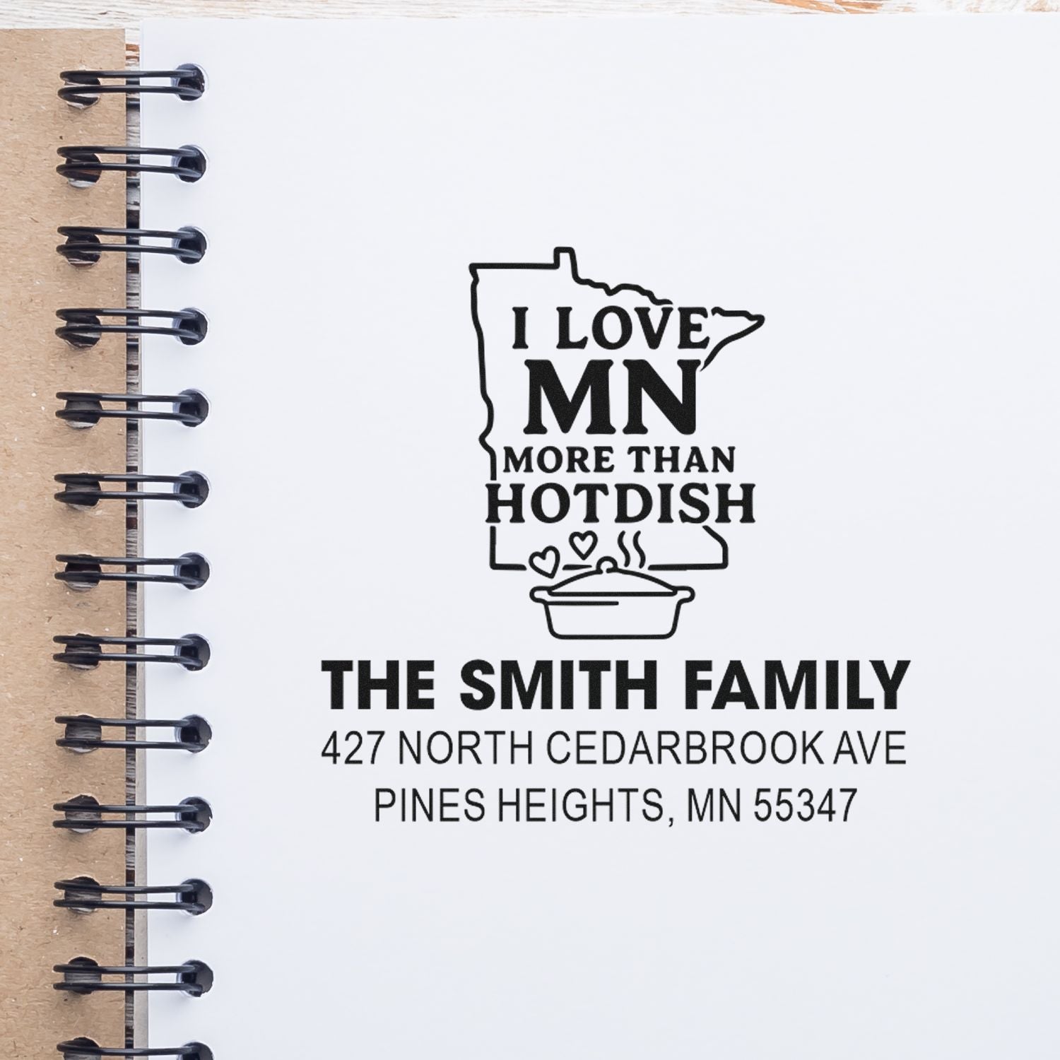 Custom Minnesota rubber stamp with I Love MN More Than Hotdish, family name, and address for personalized mail or home use.