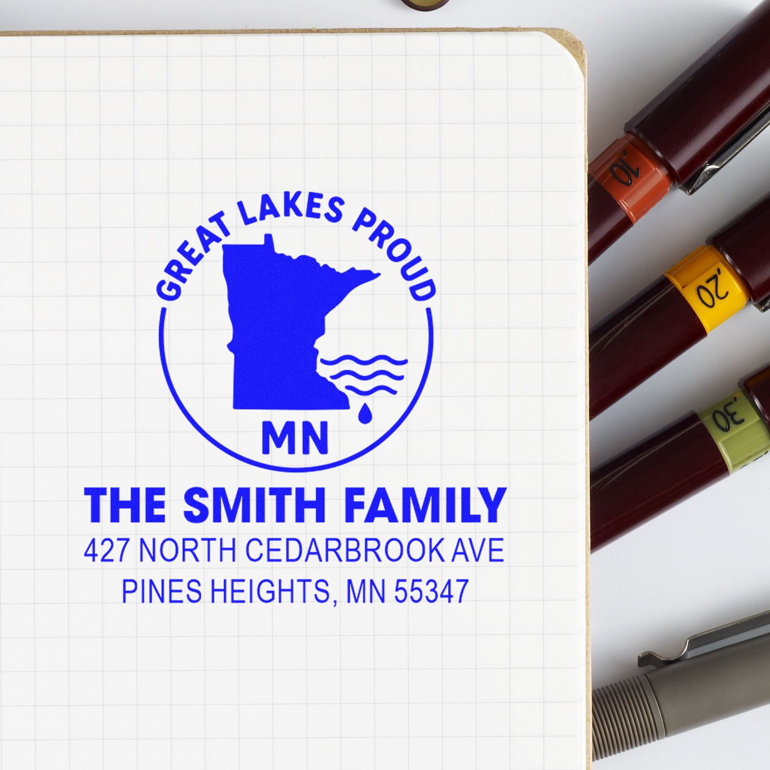 Personalized rubber return address stamp for The Smith Family with Great Lakes Proud Minnesota design and home address.