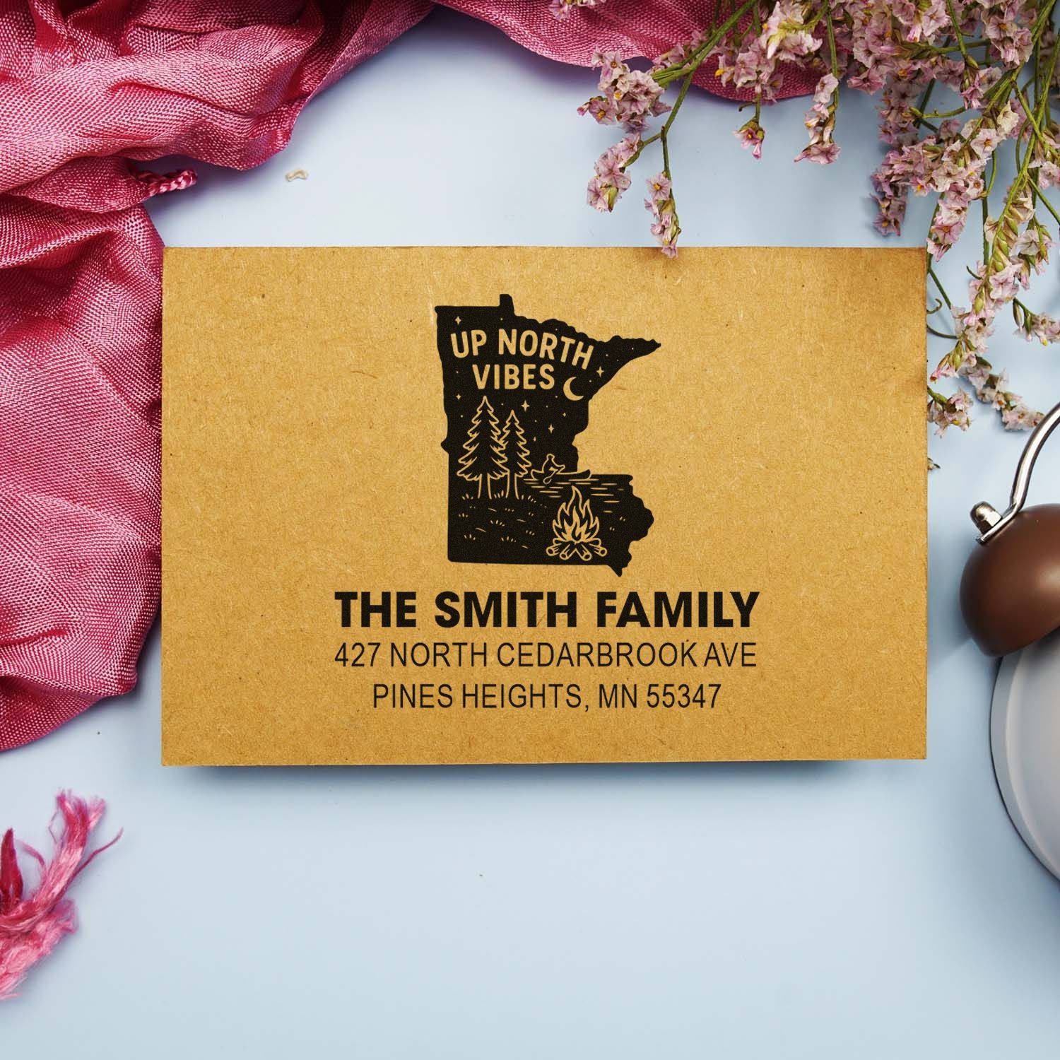 Custom return address rubber stamp on kraft envelope with Minnesota Up North Vibes family design.