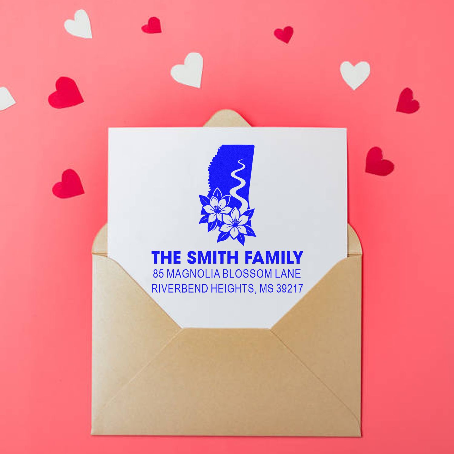 Custom rubber address stamp with floral monogram for personalized family envelopes and stationery.