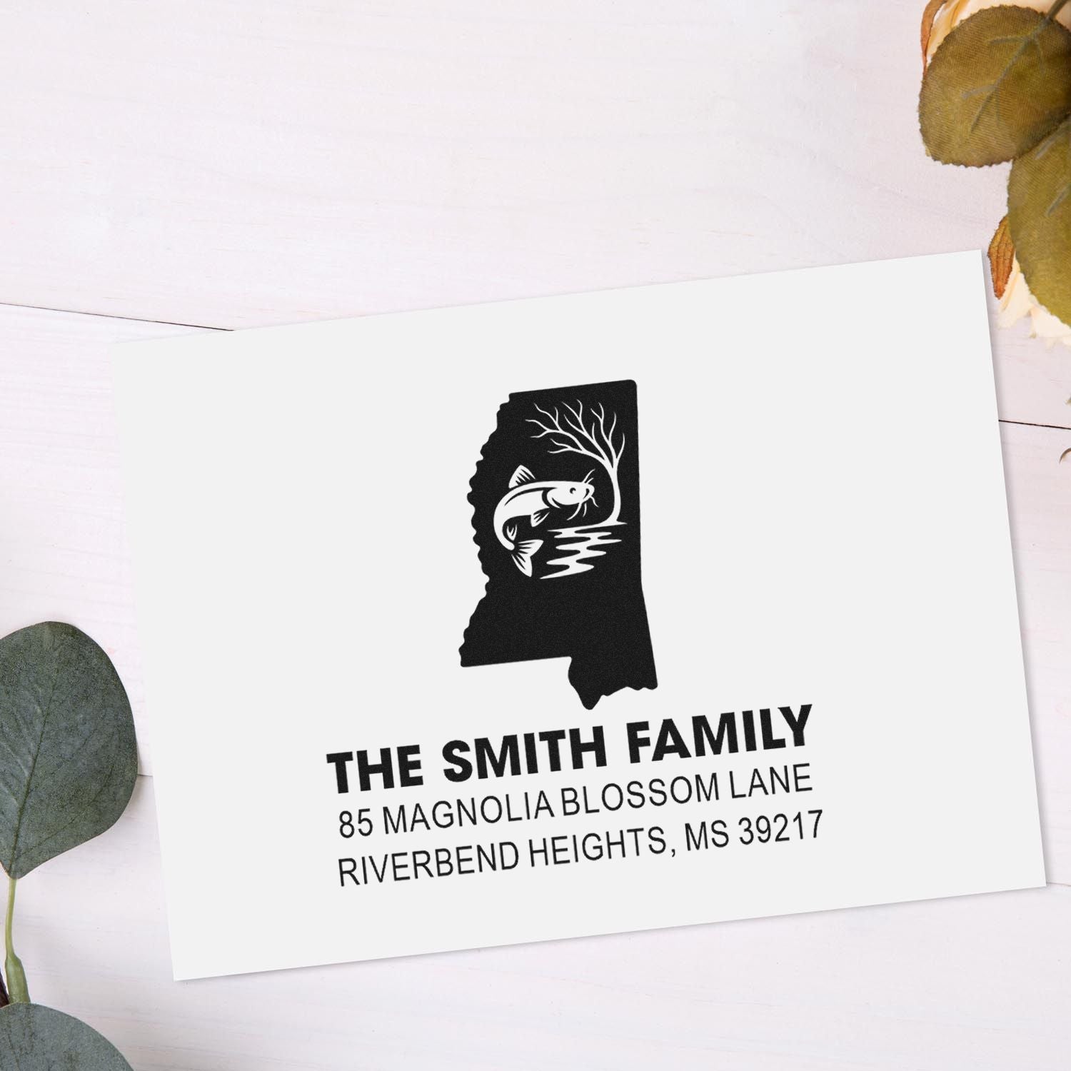 Custom Mississippi state return address rubber stamp with family name, address, and catfish design.