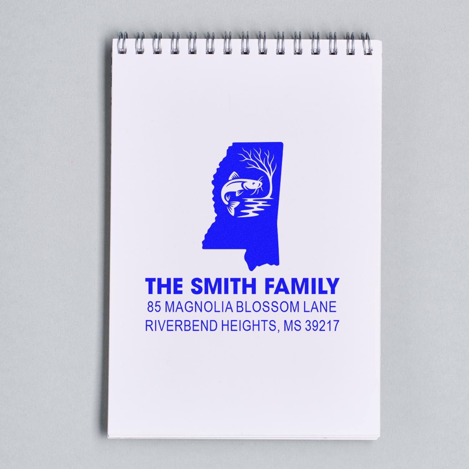 Custom Mississippi return address rubber stamp with family name, address, and catfish design.