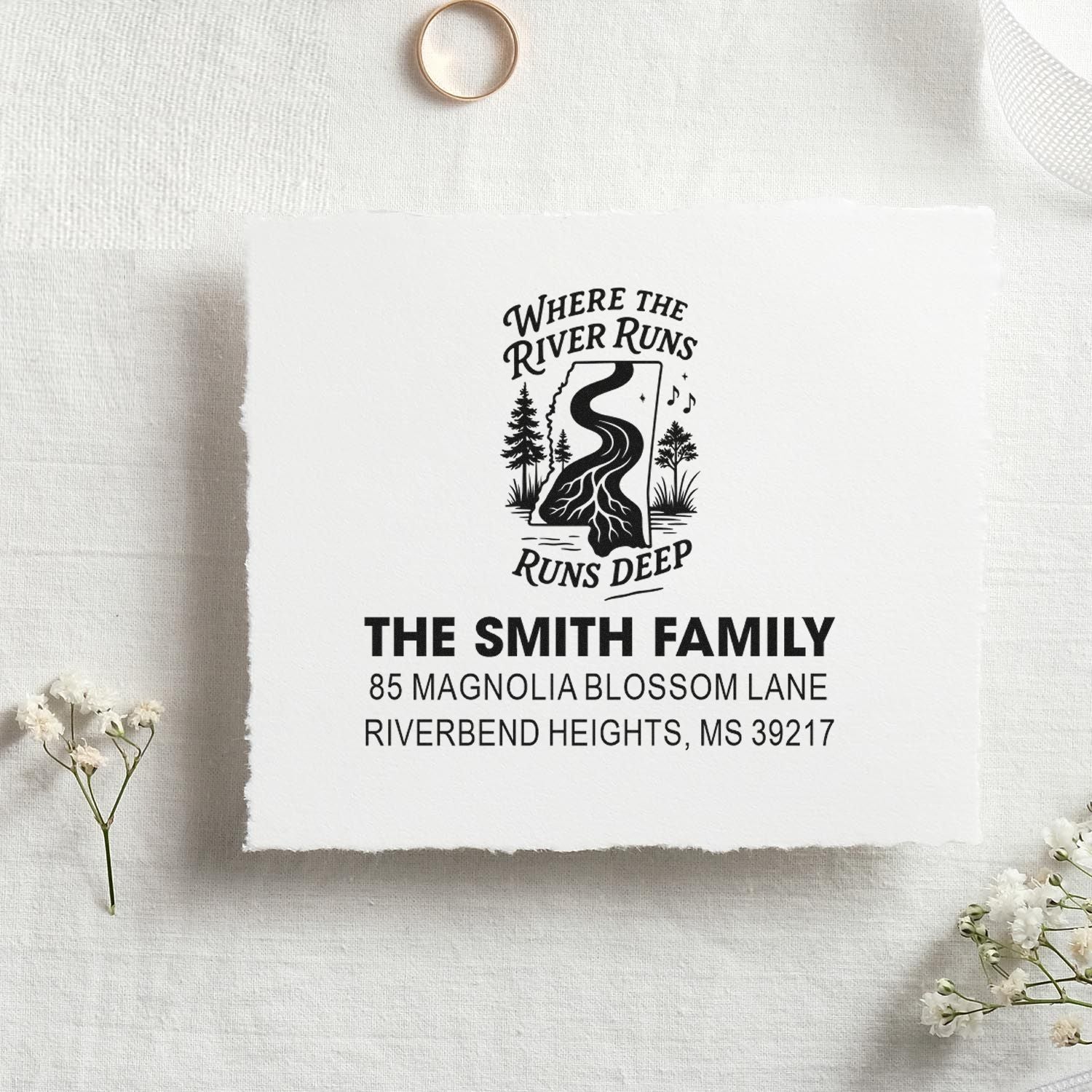 Custom return address rubber stamp with river-and-forest design for The Smith Family.