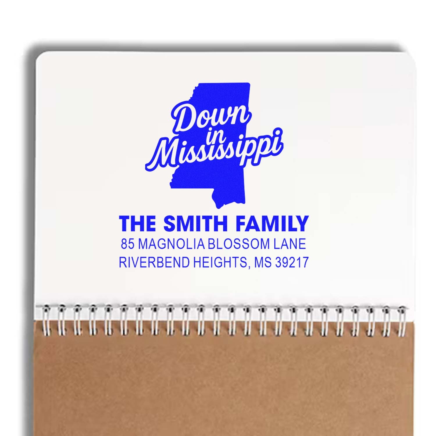 Custom rubber stamp mockup for Mississippi family address, featuring state silhouette and return address design.